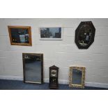 AN OAK OVAL WALL MIRROR, along with four other modern mirrors, a modern wall clock and two lamps (