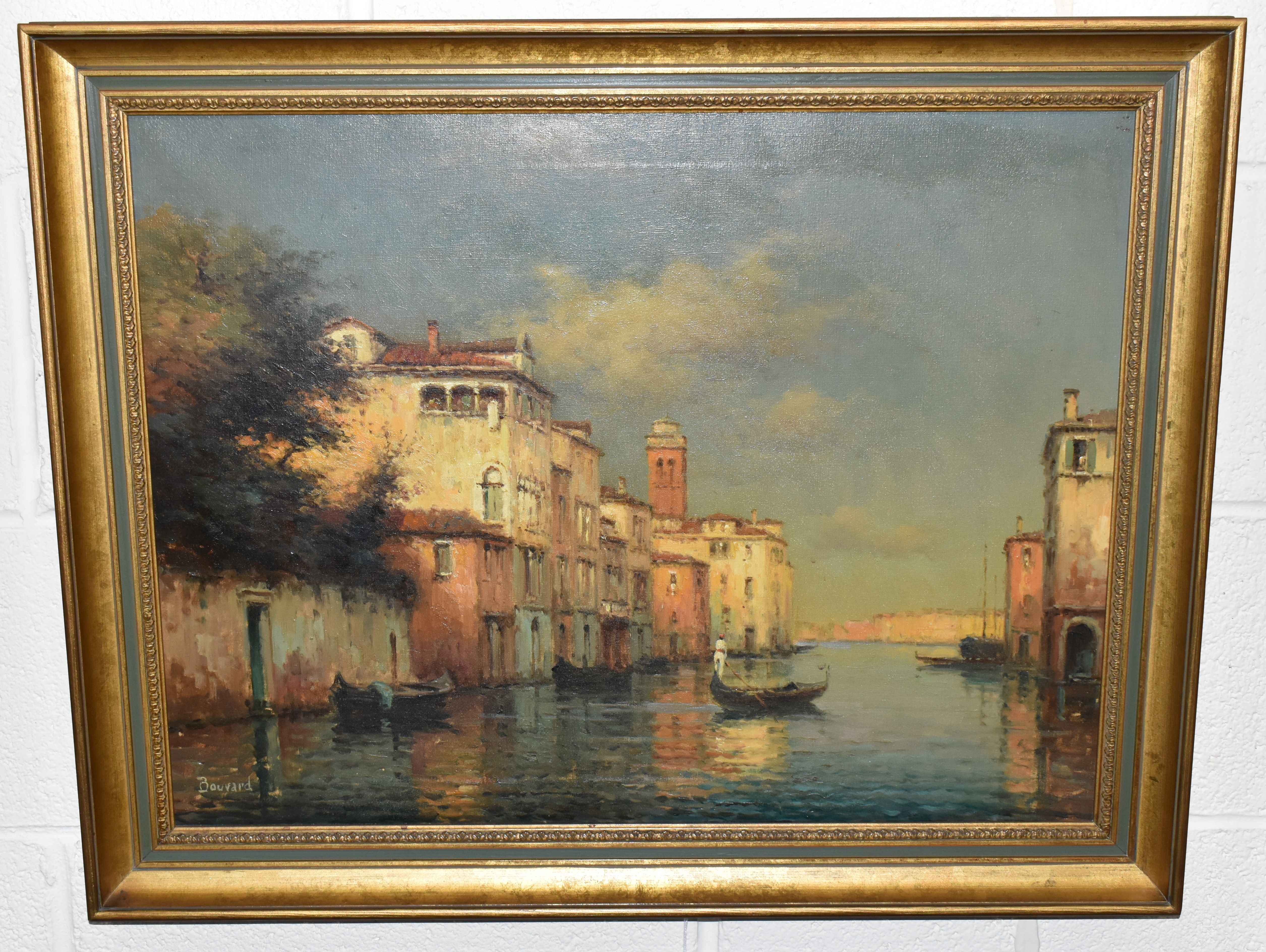 BOUVARD (20TH CENTURY) A VENETIAN CANAL SCENE, a lone gondolier steers his gondolier towards home at