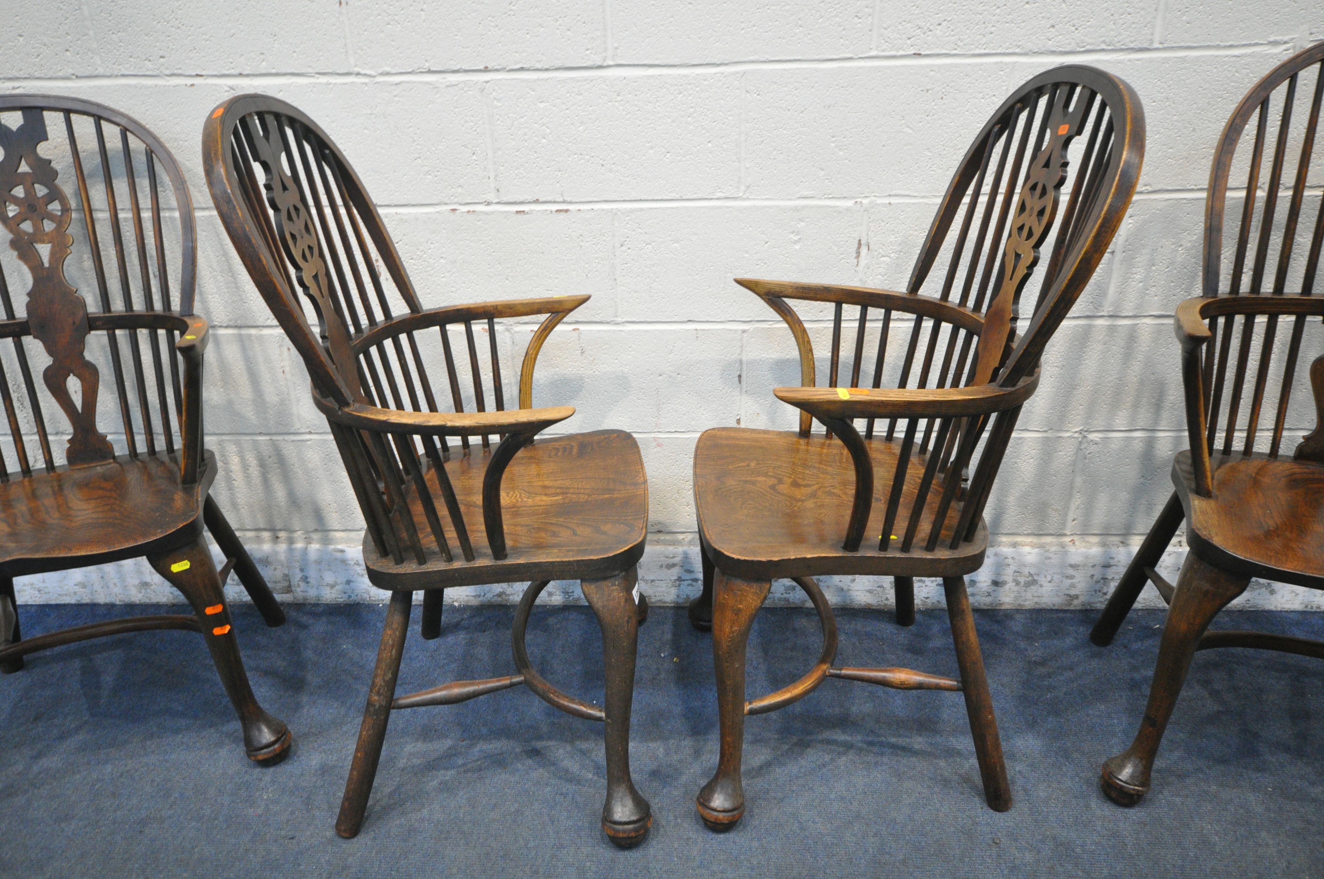 A SET OF FOUR EARLY 20TH CENTURY ELM AND BEECH HOOP BACK WINDSOR ARMCHAIR, with a wheel splat - Image 7 of 7
