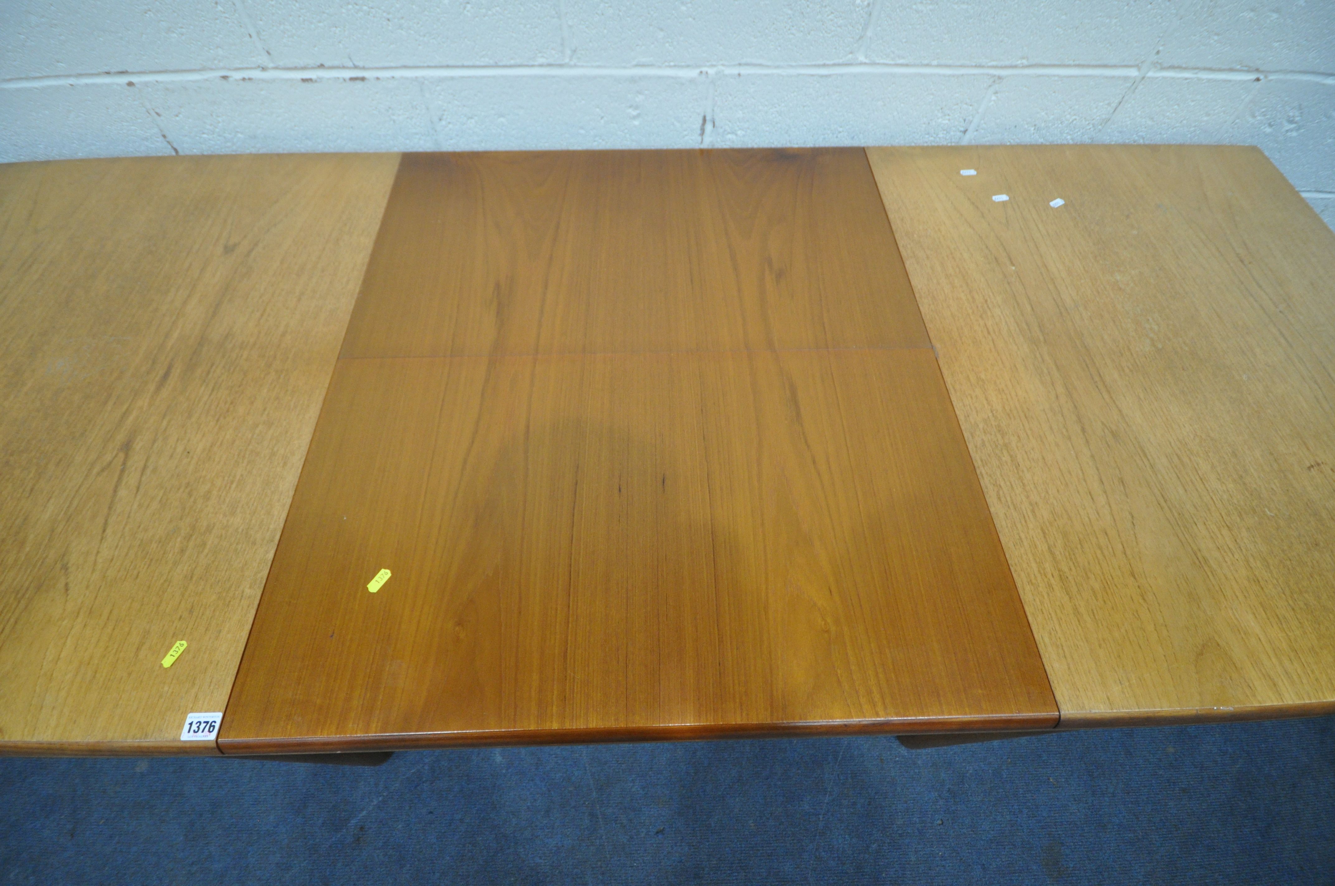 WHITE AND NEWTON LTD, A MID CENTURY TEAK EXTENDING DINING TABLE, with a single fold out leaf, - Image 7 of 9