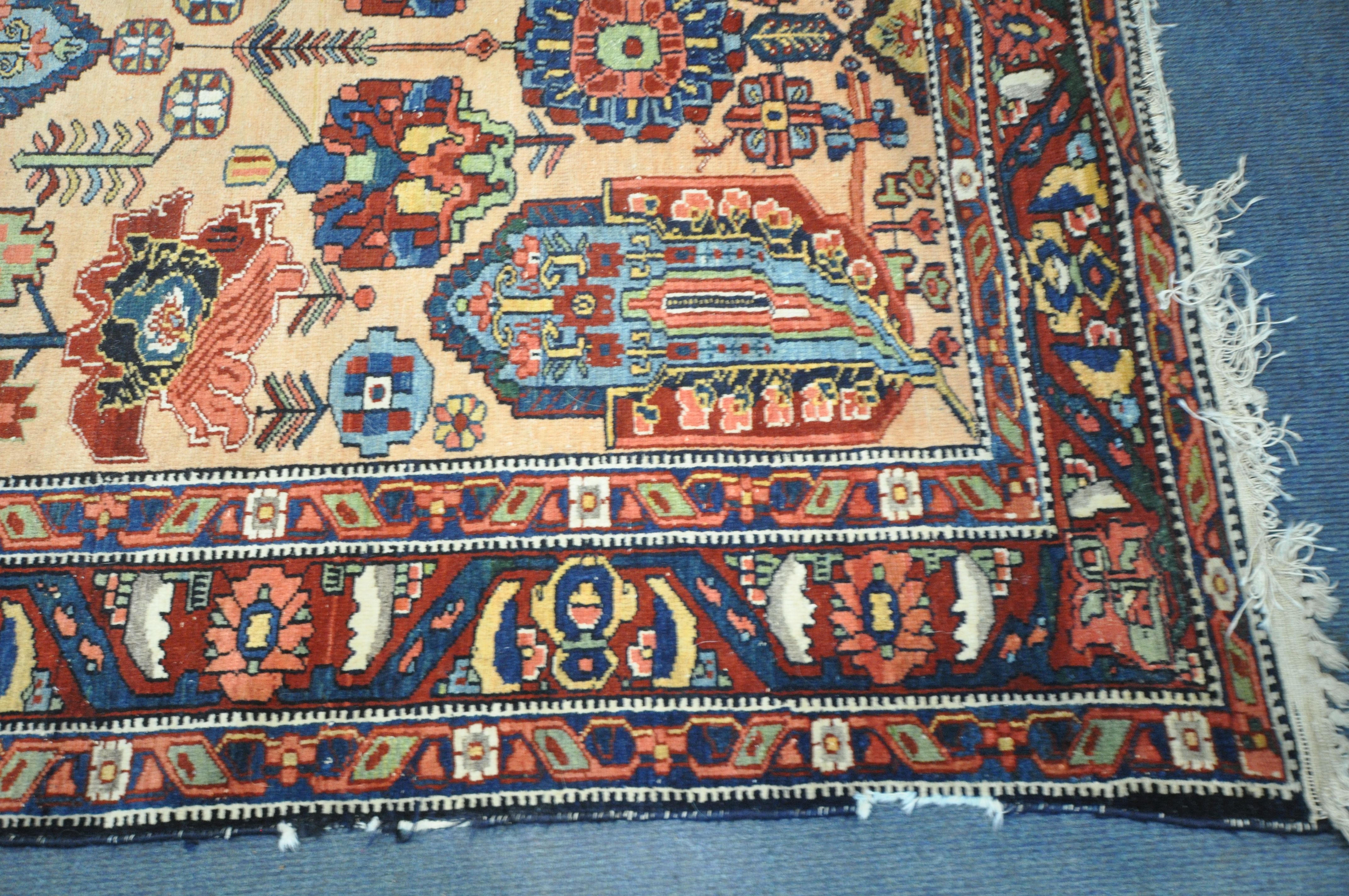 A PERSIAN MALAYER RUG, hand knotted with a repeating stylized pattern on a cream field, and - Image 2 of 7