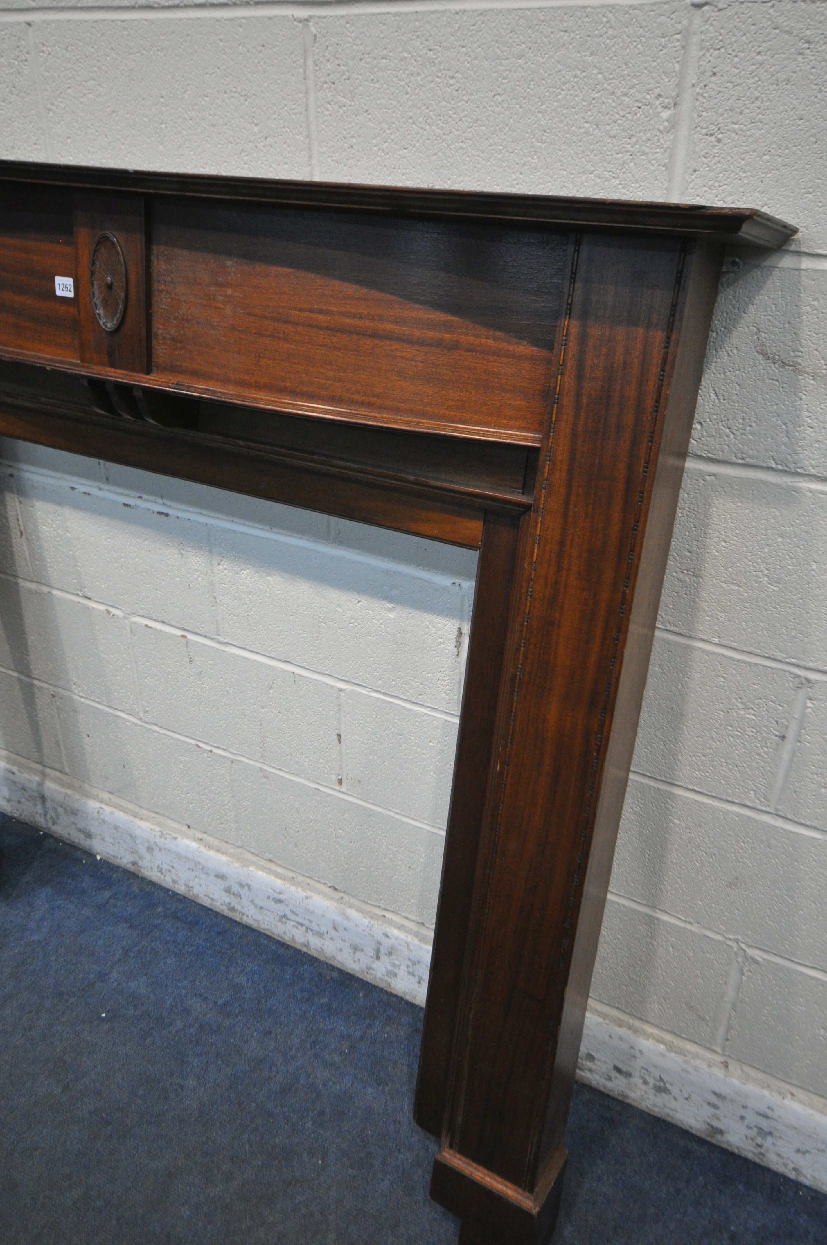 A MAHOGANY FIRE SURROUND, width 153cm x height 139cm (condition report: pieces cut out to fit in a - Image 2 of 2