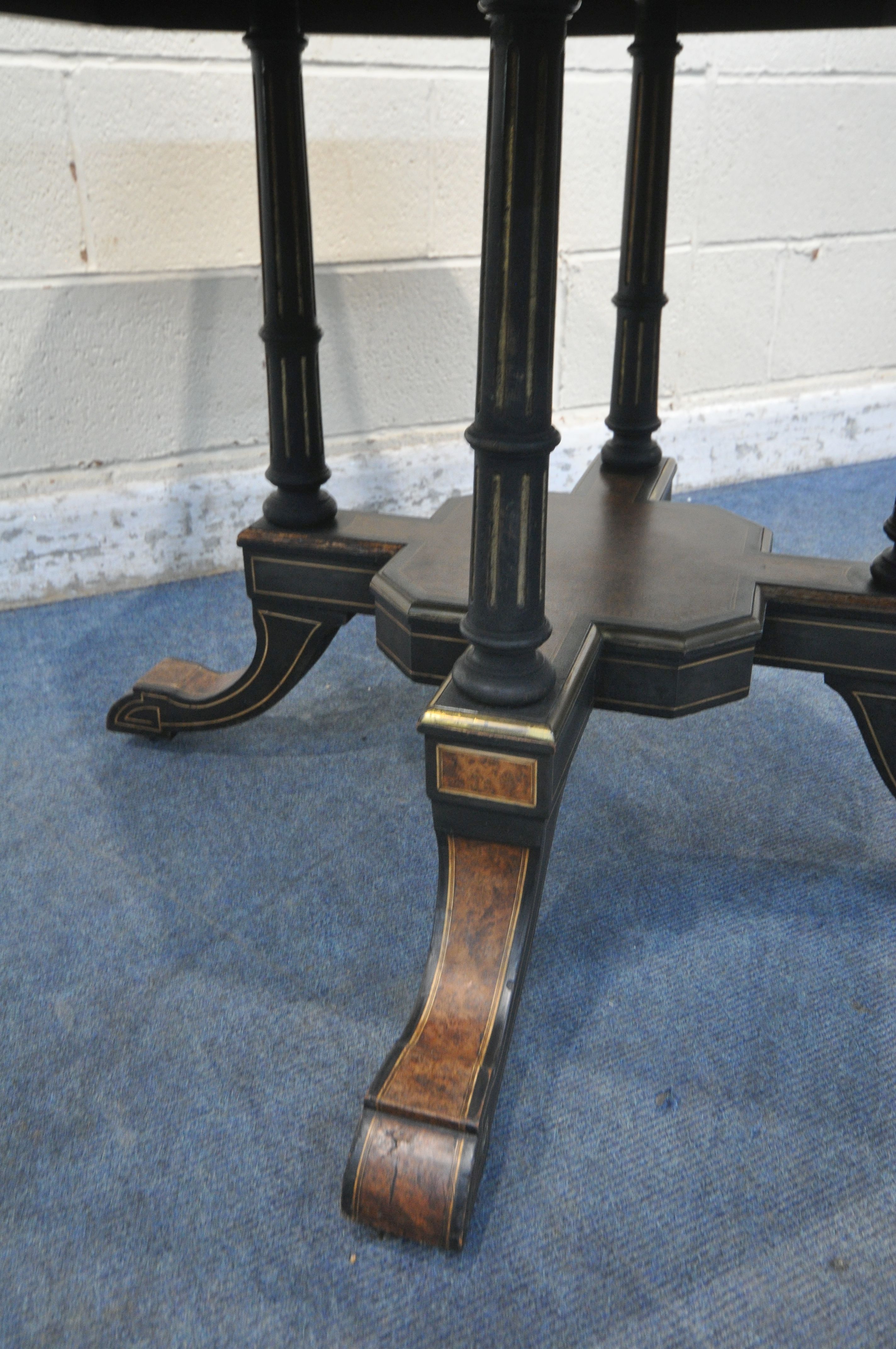 A MID TO LATE 19TH CENTURY EBONISED AND AMBOYNA OCTAGONAL CENTRE TABLE, with brass and porcelain - Image 4 of 6