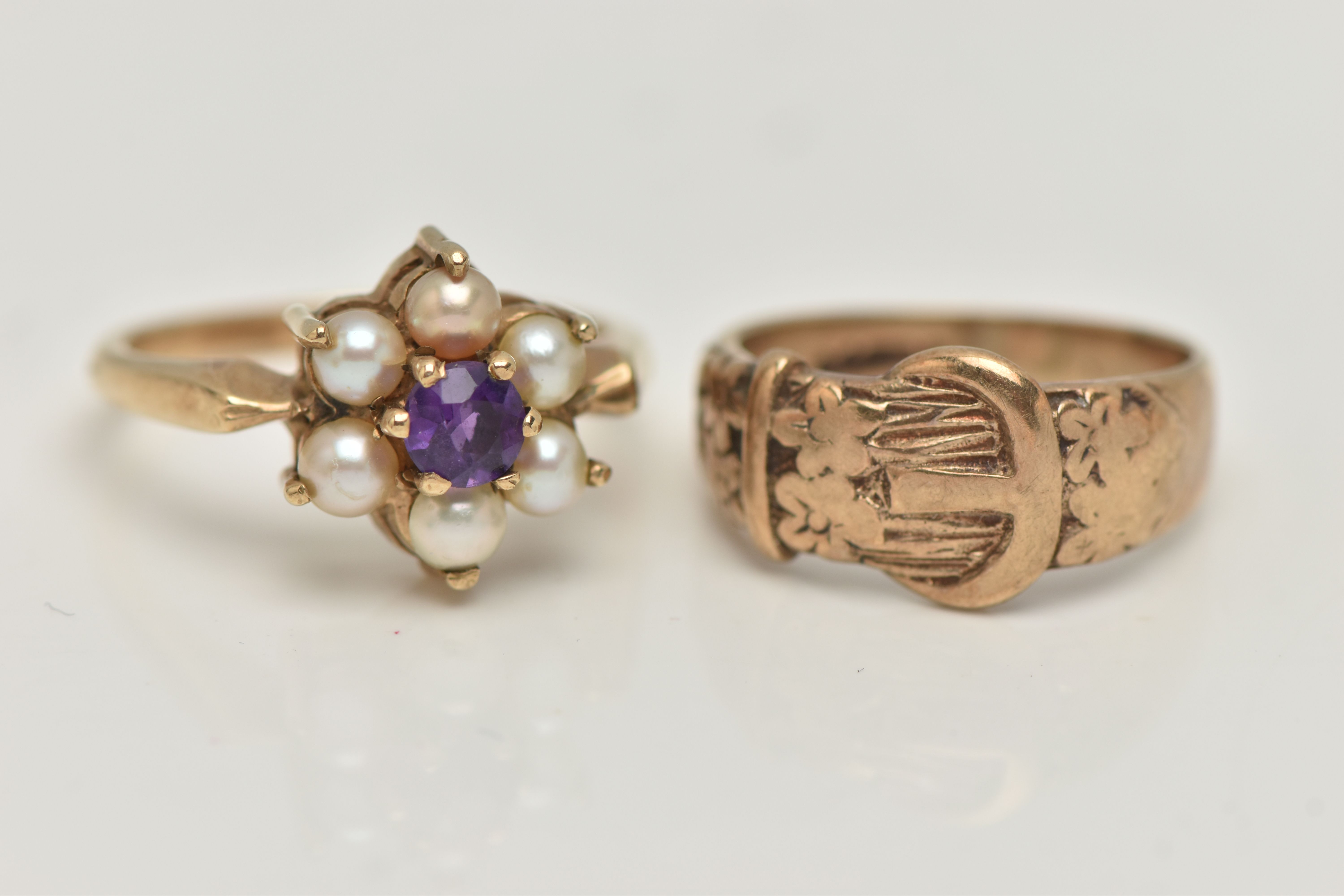 A 9CT GOLD RING AND A GEM SET RING, a 9ct gold buckle ring with floral detail, hallmarked 9ct London