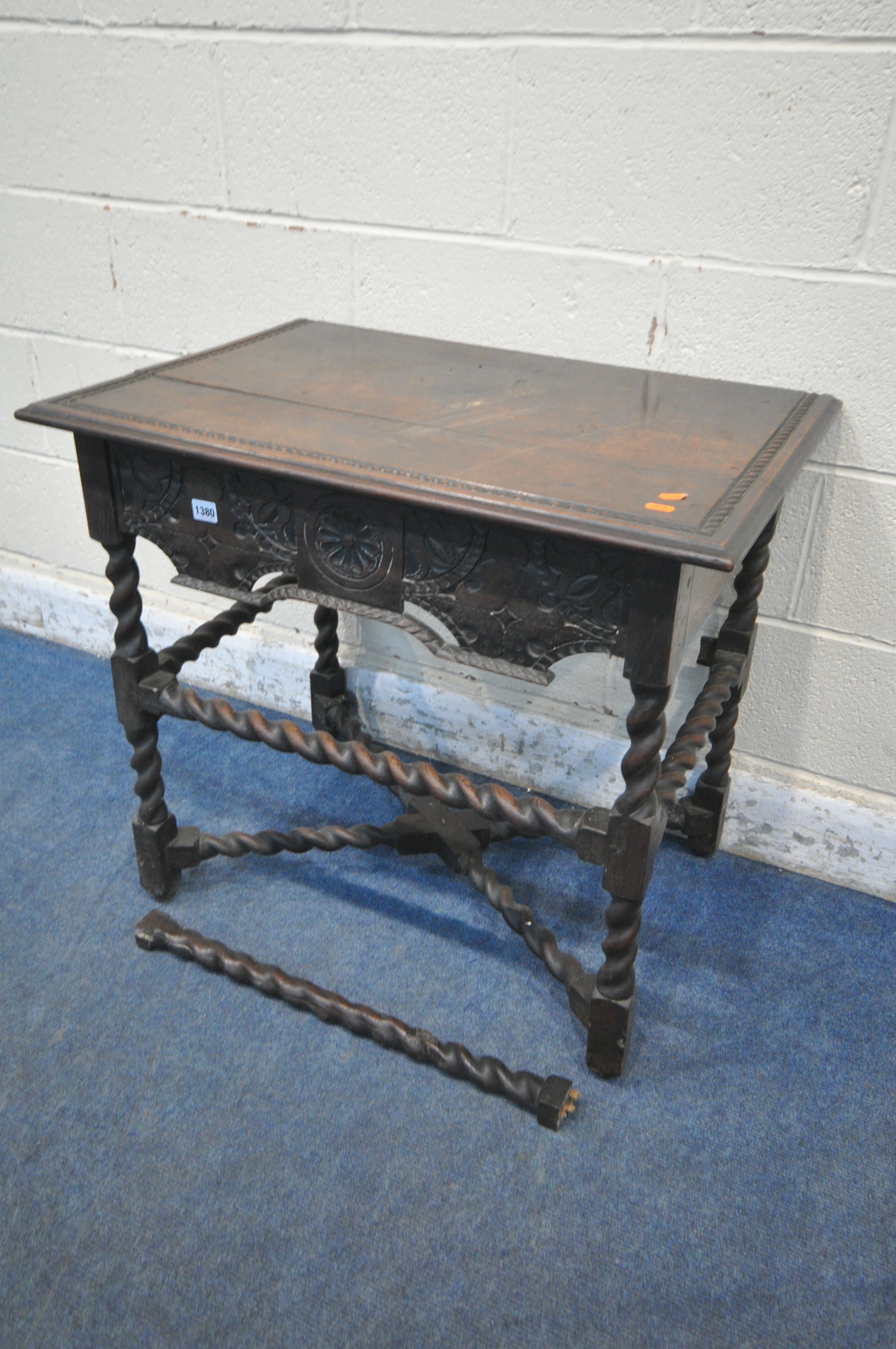 AN 18TH CENTURY CARVED OAK SIDE TABLE, the top edges with a rope edge, above a single frieze drawer,
