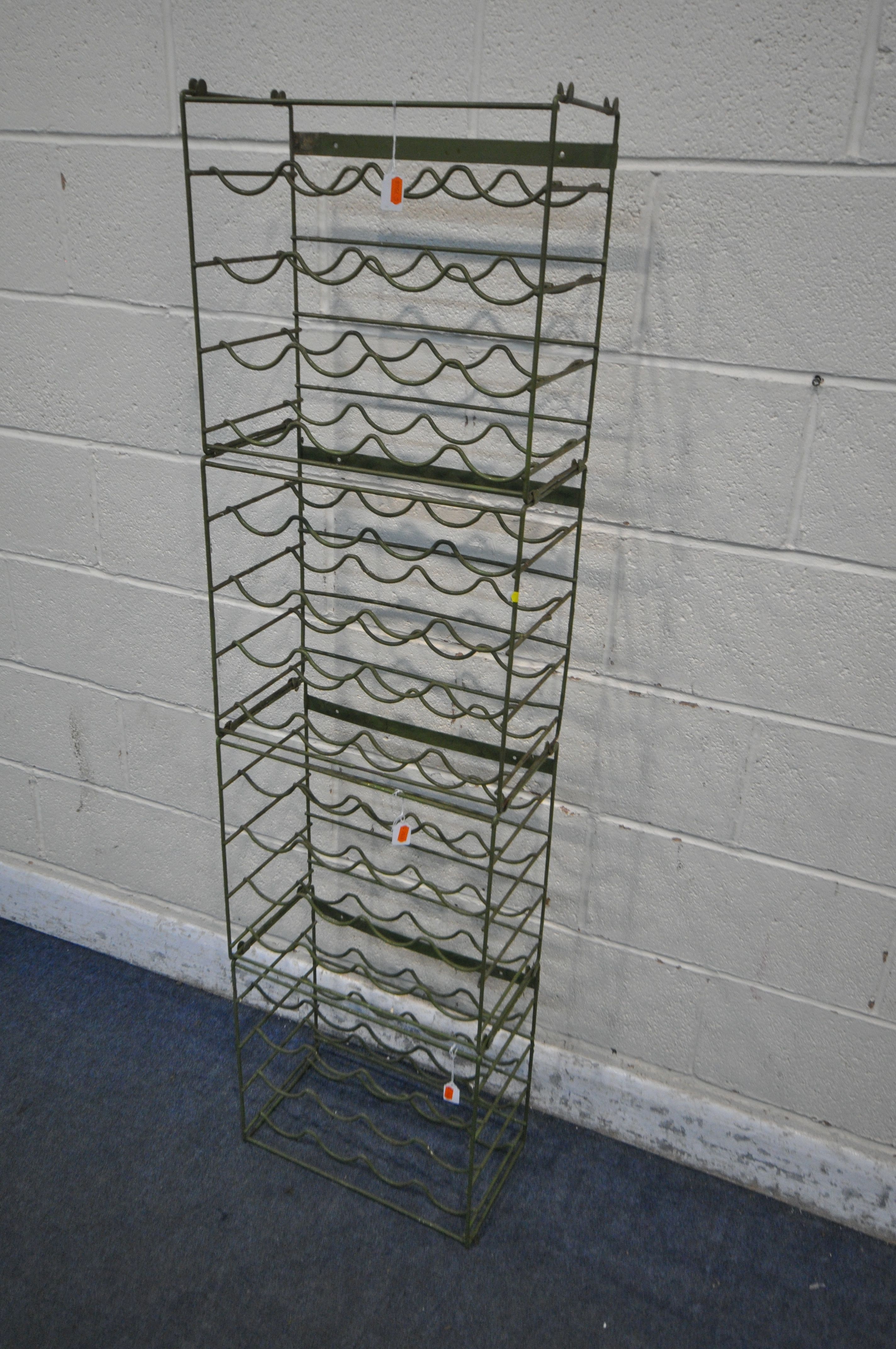 A SET OF FOUR STACKING INDUSTRIAL WIRE WINE RACKS (condition report: worn finish) (4)