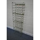 A SET OF FOUR STACKING INDUSTRIAL WIRE WINE RACKS (condition report: worn finish) (4)