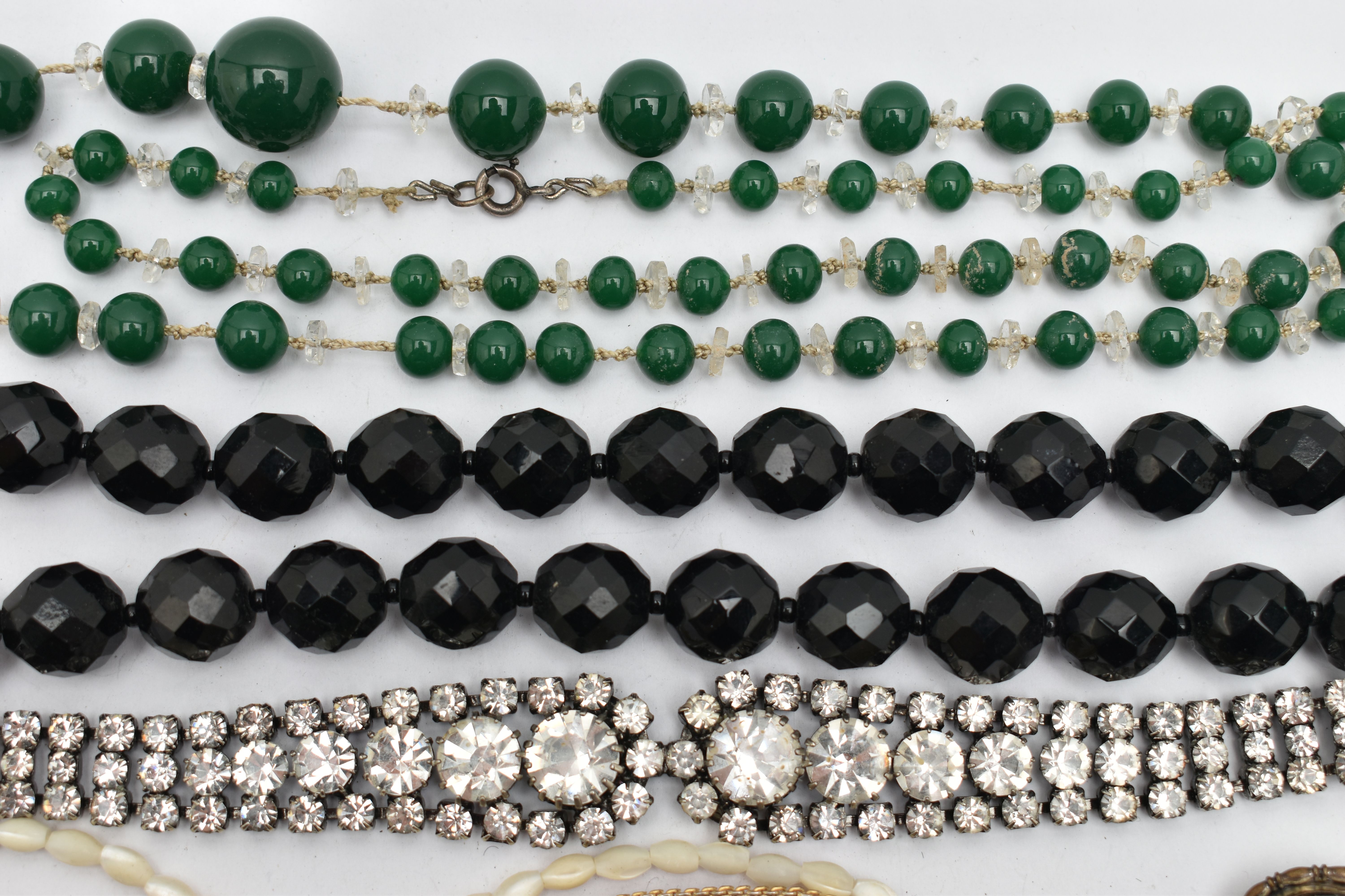 A BAG OF COSTUME JEWELLERY, two paste set white metal necklaces, a green beaded necklace, a mother - Image 3 of 7