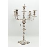 A GEORGE V SILVER FIVE LIGHT CANDELABRUM IN GEORGE II STYLE, with removable shaped square drip pans,