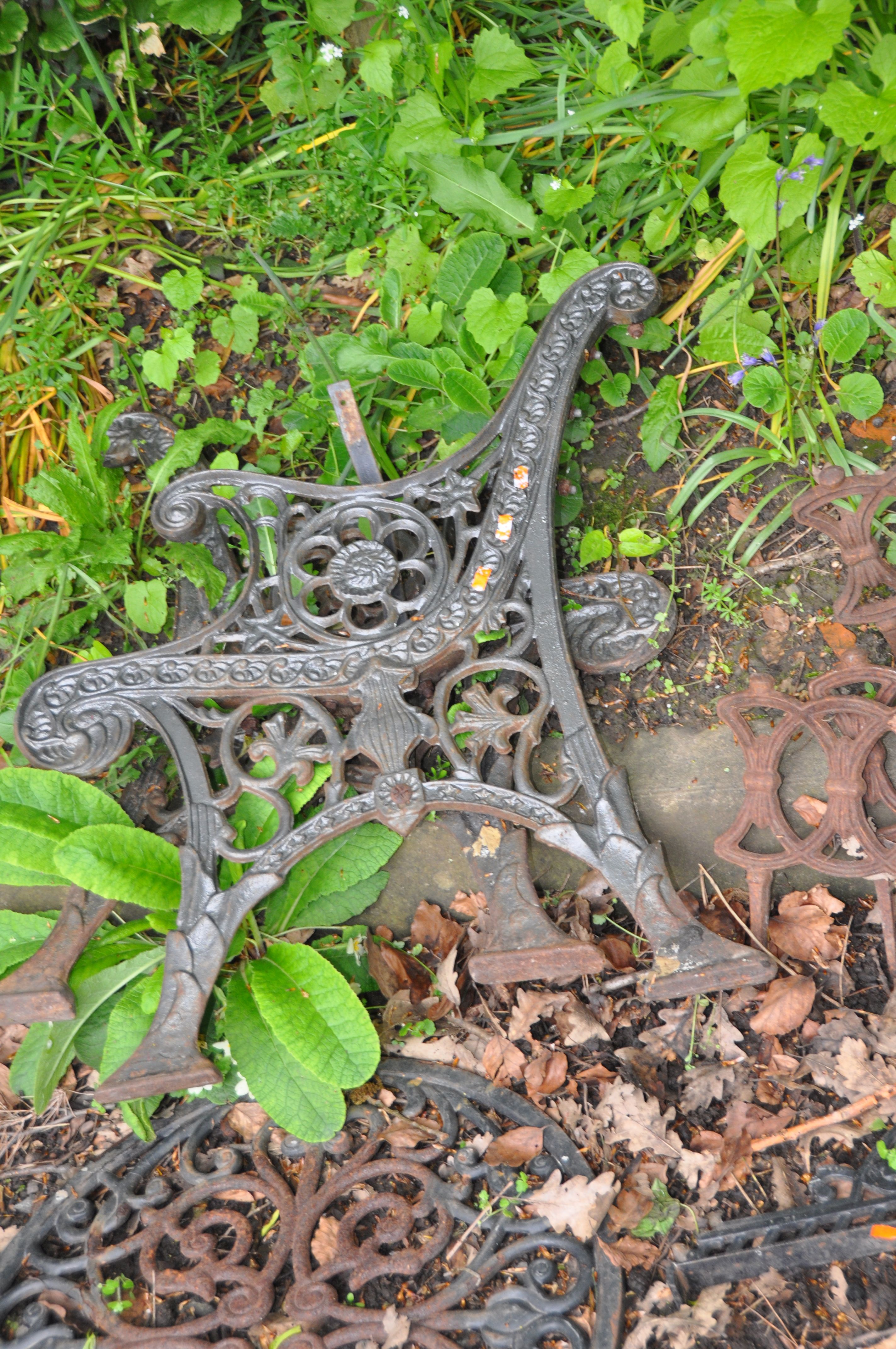 A COLLECTION OF CAST IRON GARDEN ITEMS including seven Victorian lawn edgers, a modern table top, - Image 6 of 6