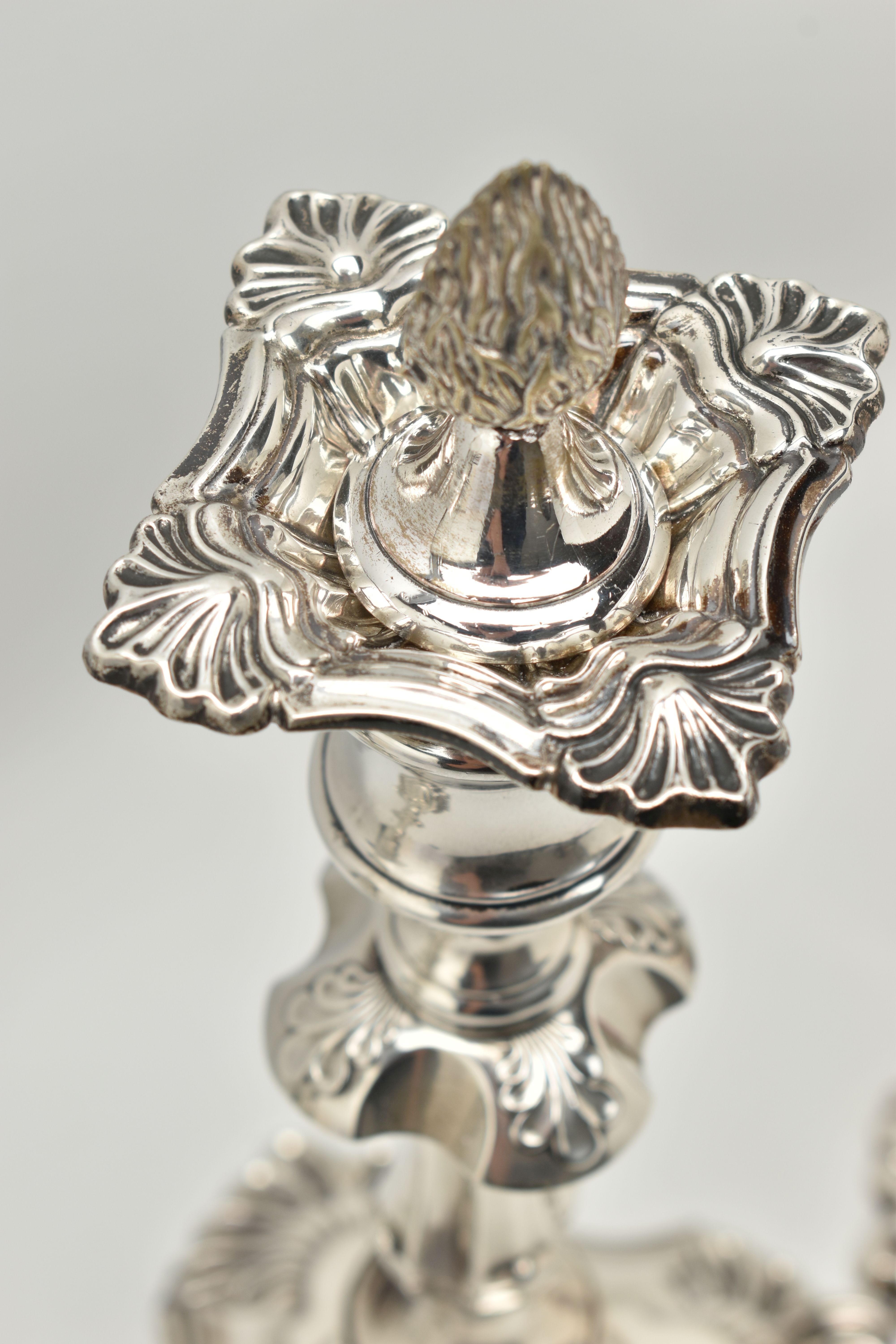 A GEORGE V SILVER SET OF FOUR CANDLESTICKS IN GEORGE II STYLE, with removable shaped square drip - Image 5 of 10