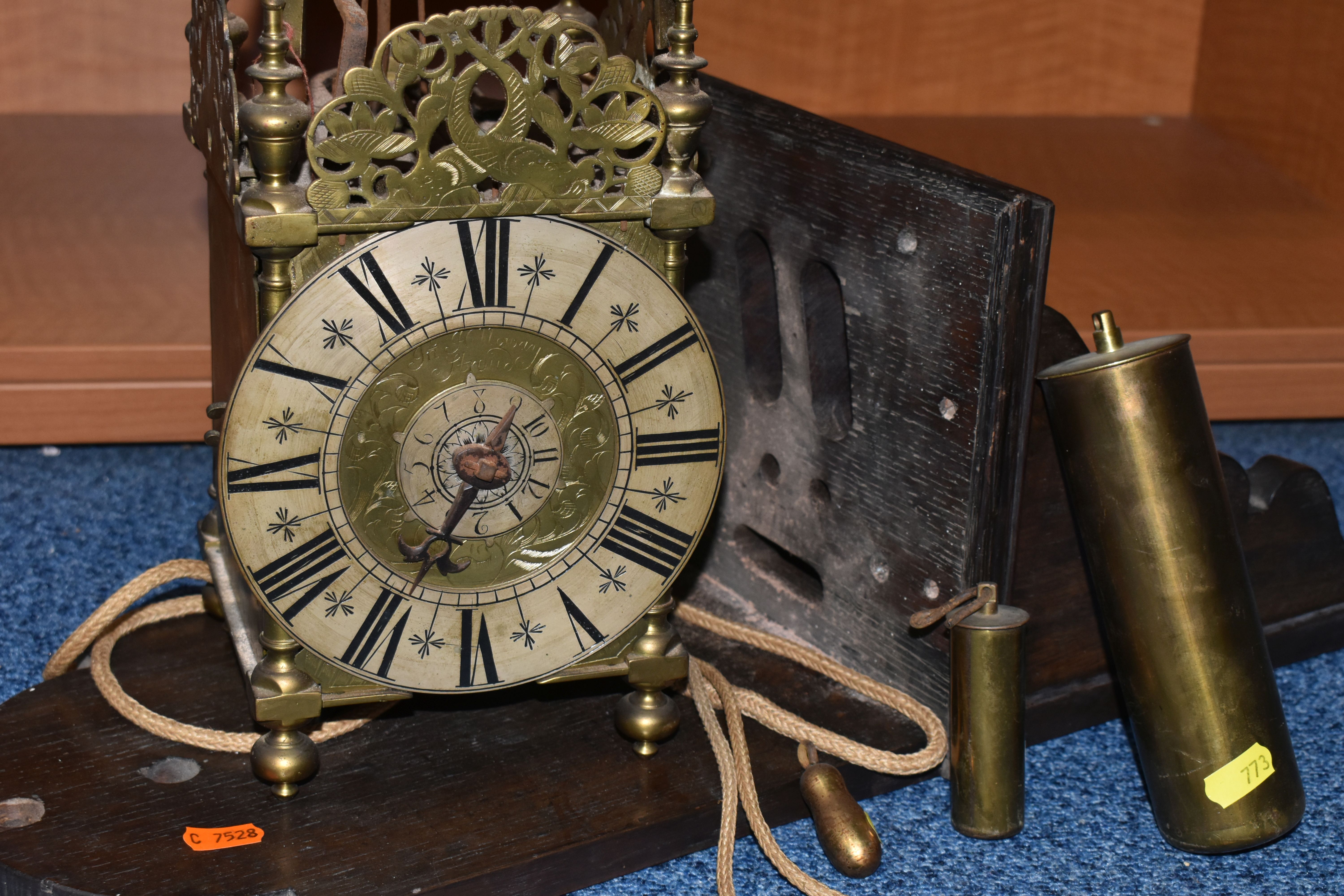 A 17TH CENTURY STYLE BRASS LANTERN CLOCK, four posted case with side doors and side frets,