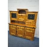 A PINE DRESSER, the top made up in an arrangement of drawers and cupboard, above a base with three