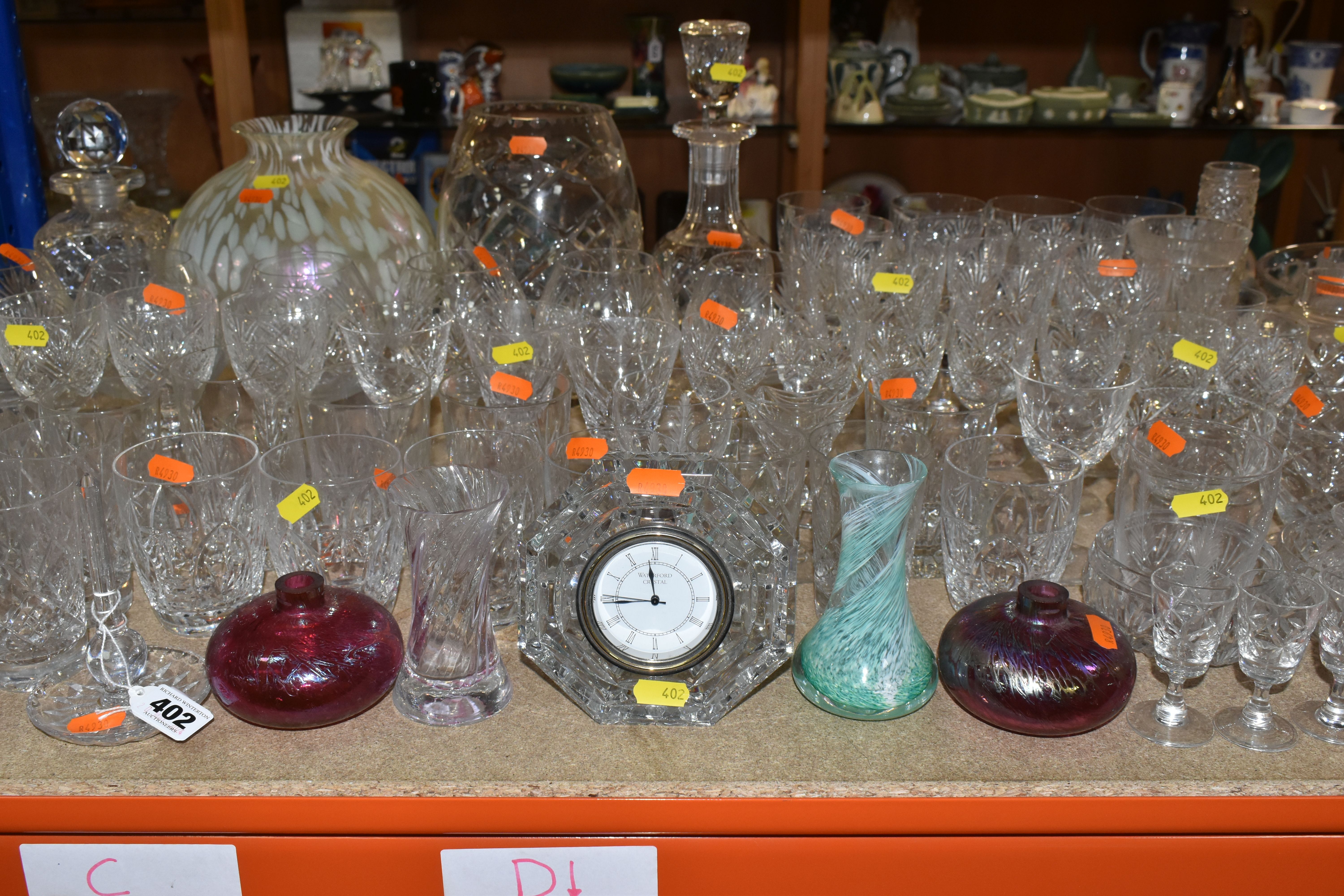 A LARGE SELECTION OF GLASSWARE INCLUDING A WATERFORD CRYSTAL CLOCK, TOGETHER WITH A VARIETY OF