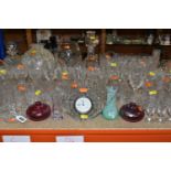 A LARGE SELECTION OF GLASSWARE INCLUDING A WATERFORD CRYSTAL CLOCK, TOGETHER WITH A VARIETY OF