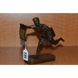 A 1930'S POLITAL INTEREST BRONZE FIGURE OF A BARE FOOTED NEWSPAPER BOY POSED AS RUNNING, with a
