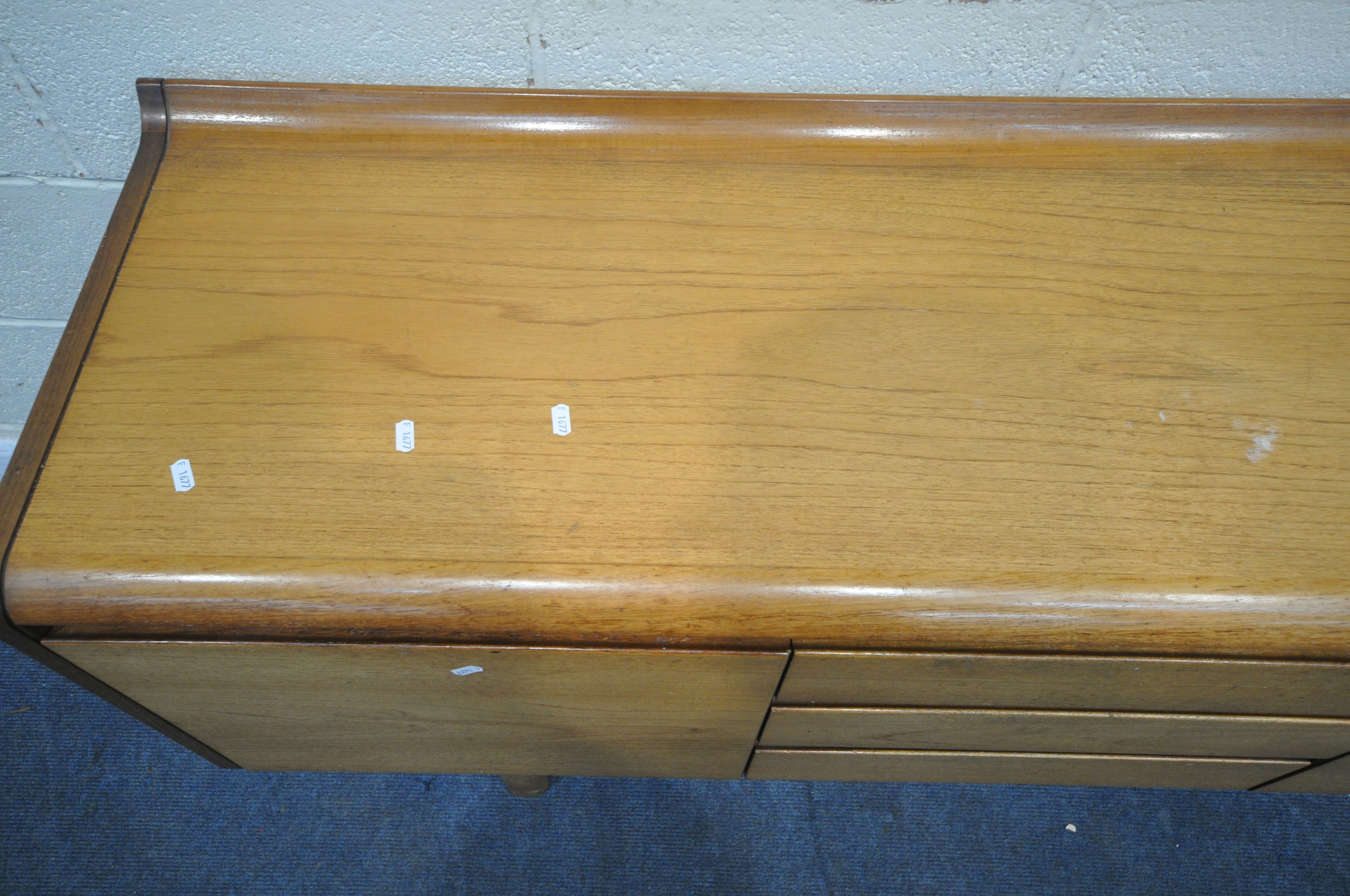 WHITE AND NEWTON LTD, A MID CENTURY TEAK SIDEBOARD, fitted with a fall front door, double cupboard - Image 2 of 9