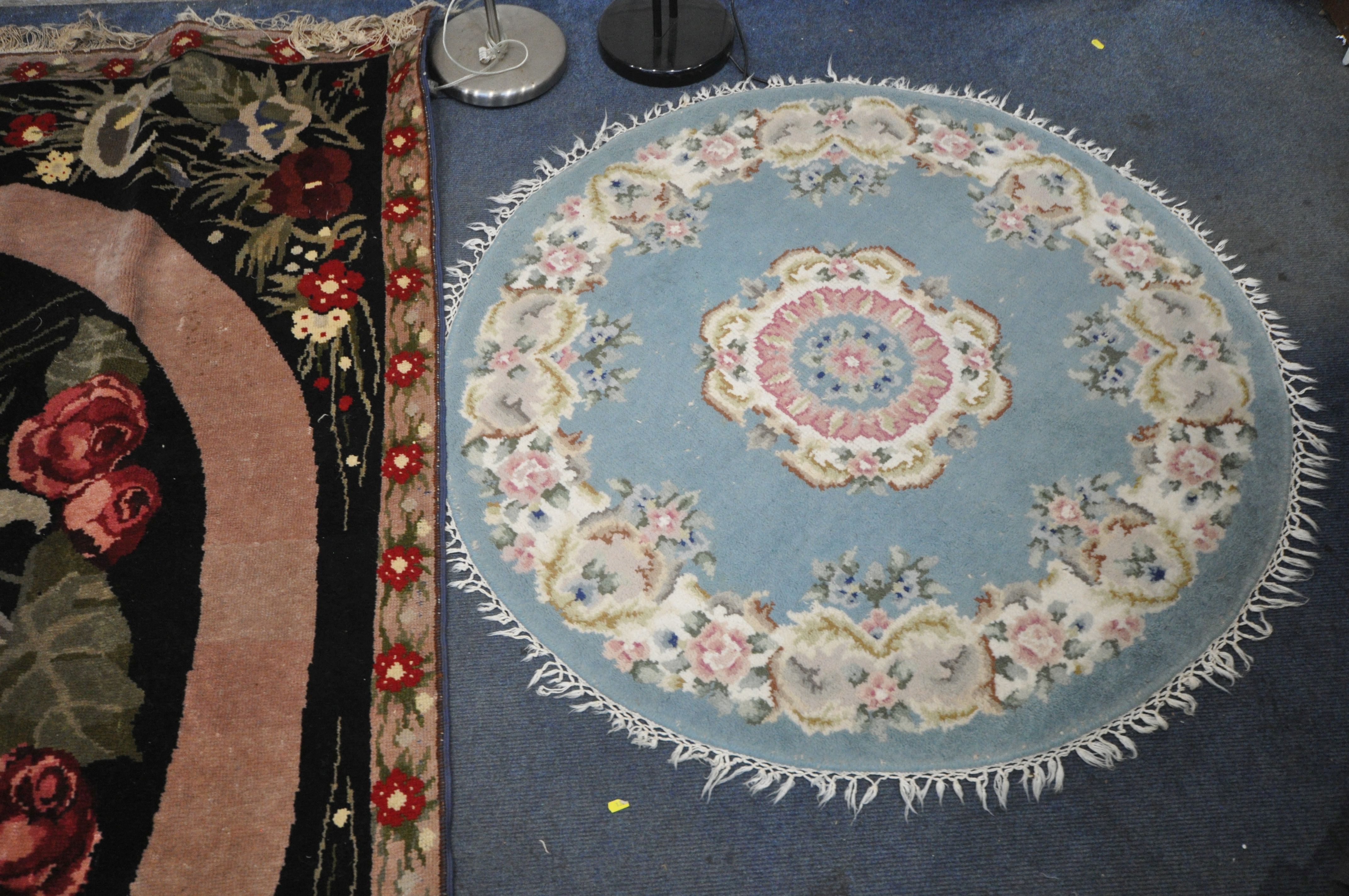 A WOOLLEN FLORAL RUG, on a black ground, 248cm x 168cm, along with a Chinese blue circular rug, - Image 3 of 4