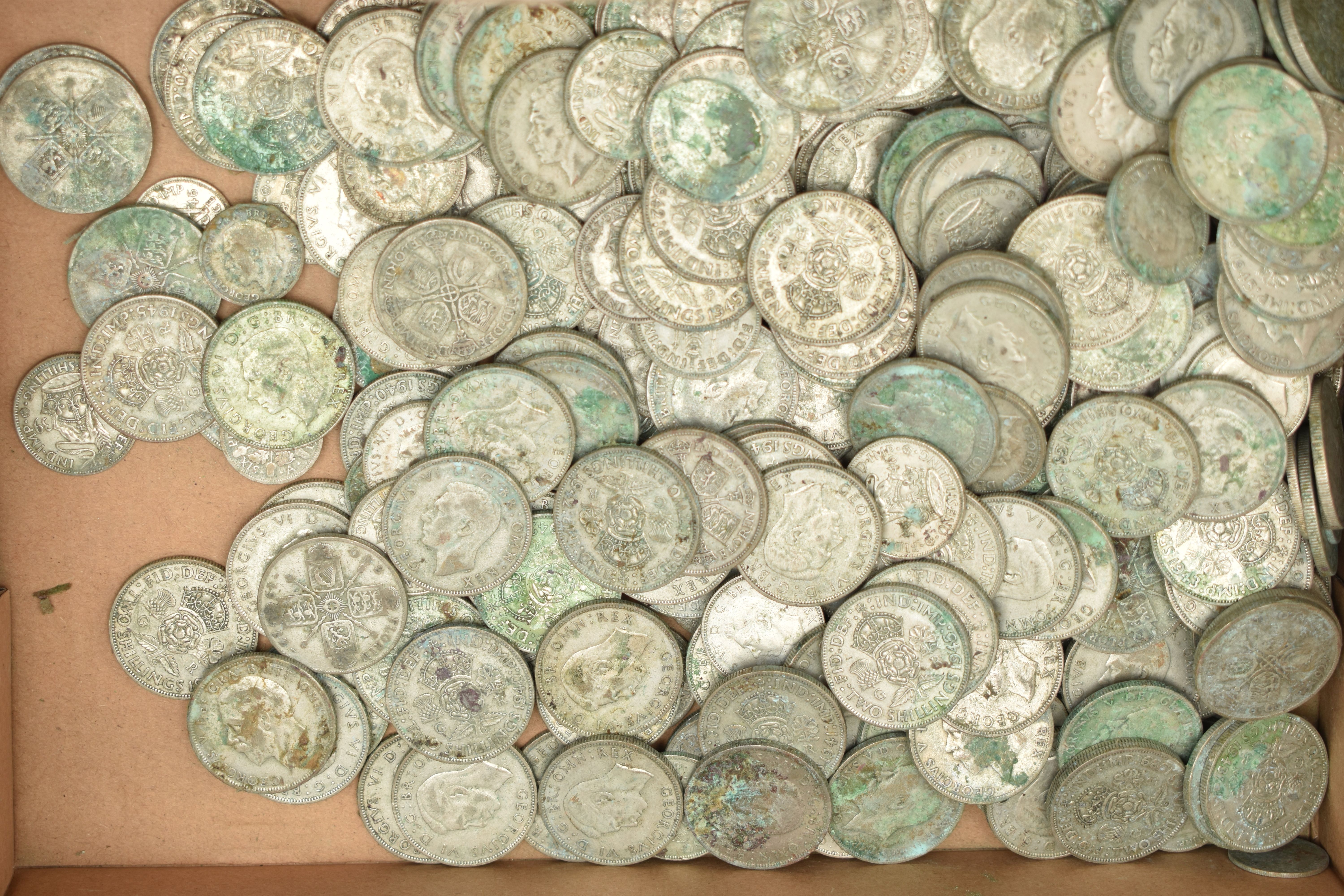 A CARDBOARD BOX OF OVER 2000 GRAMS OF .500 FINE MIXED SILVER COINS (condition report: require some