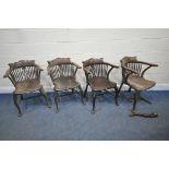 A SET OF FOUR ELM ARMCHAIRS, with shaped crest, spindle supports, central splat back, raised on