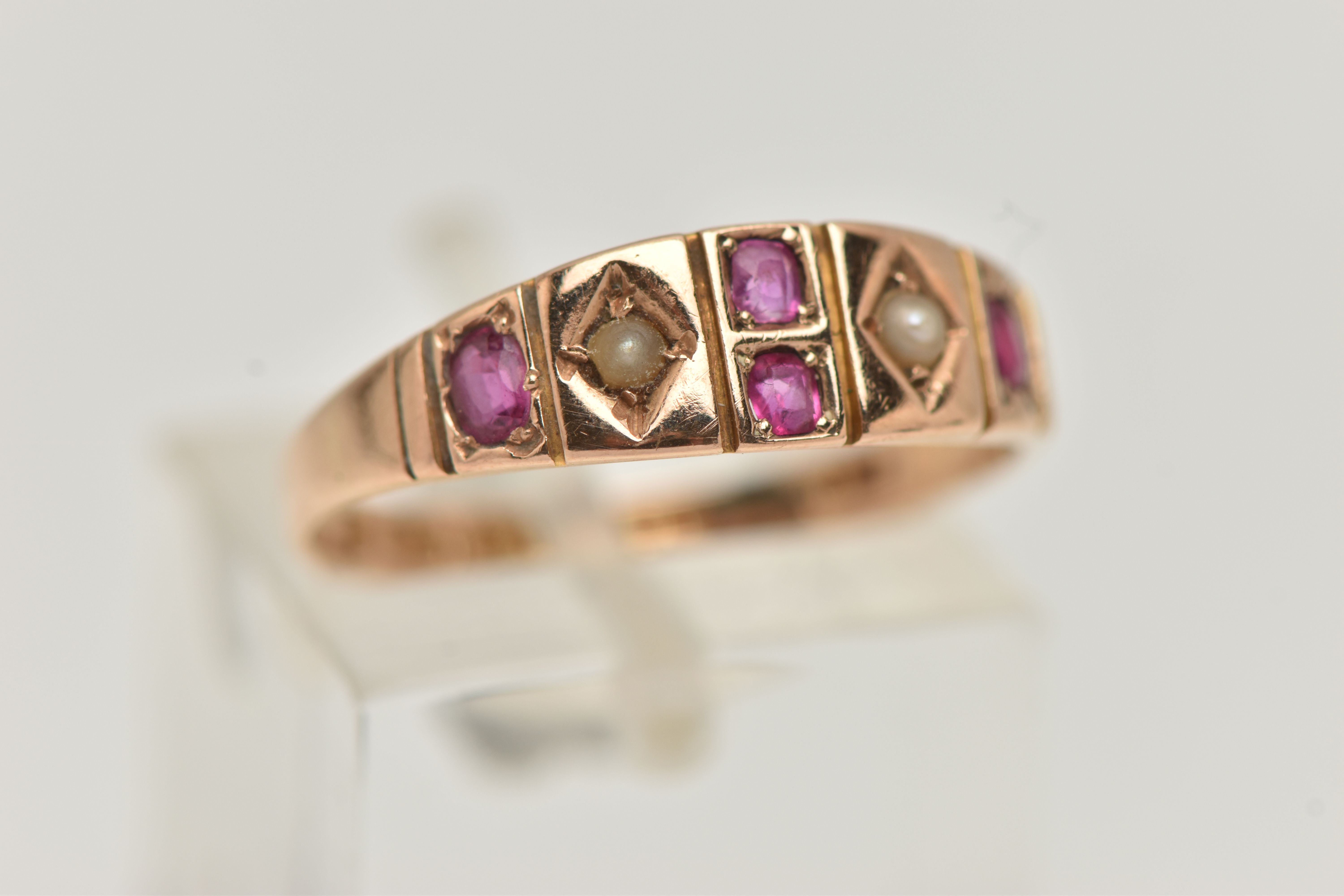 A MID VICTORIAN 15CT GOLD RUBY AND SPLIT PEARL RING, designed as two split pearls interspaced by - Image 4 of 4