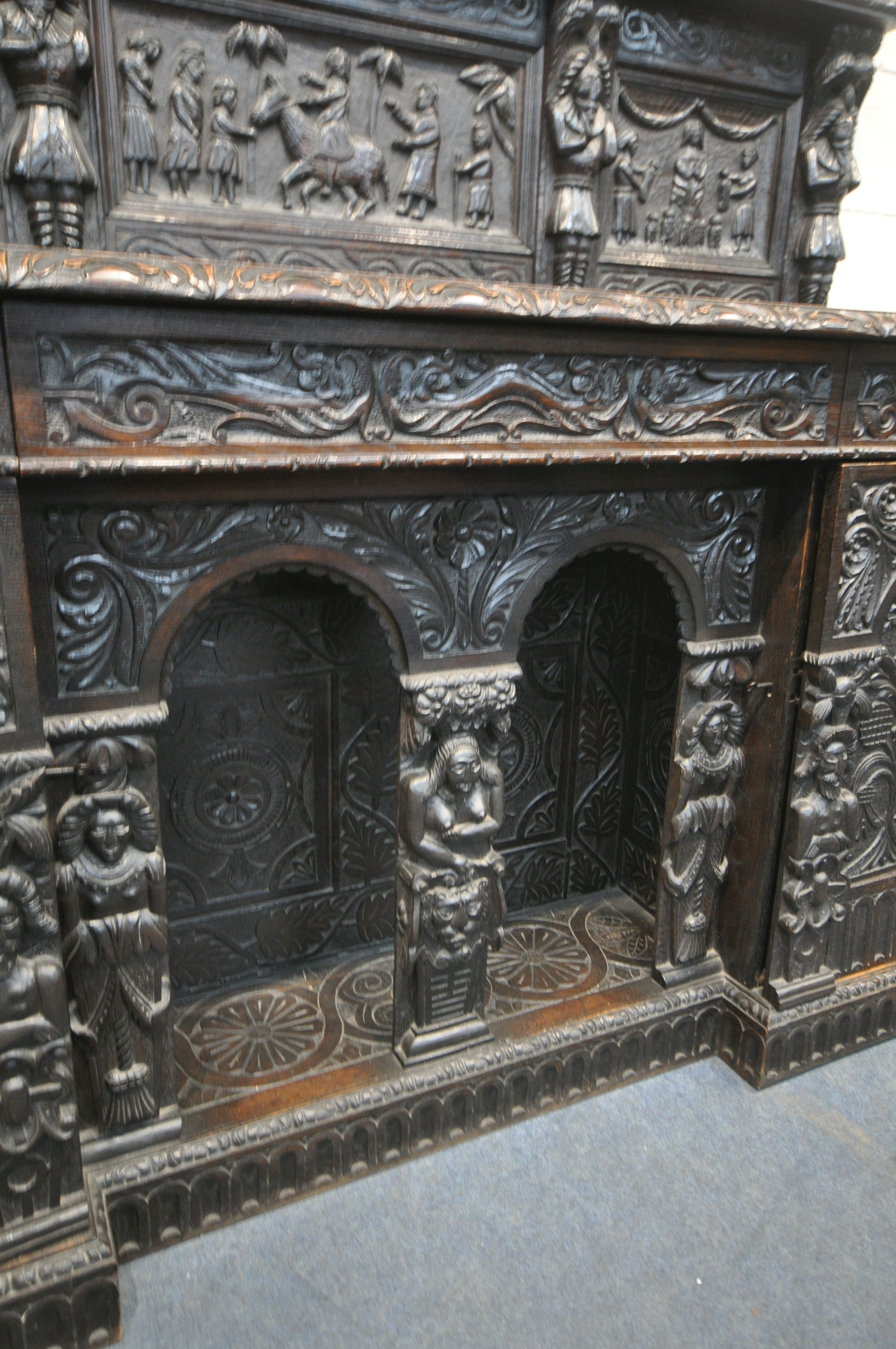 A 19TH CENTURY HEAVILY CARVED OAK SIDEBOARD, the raised back with panelling and shelf, fitted with - Image 6 of 10