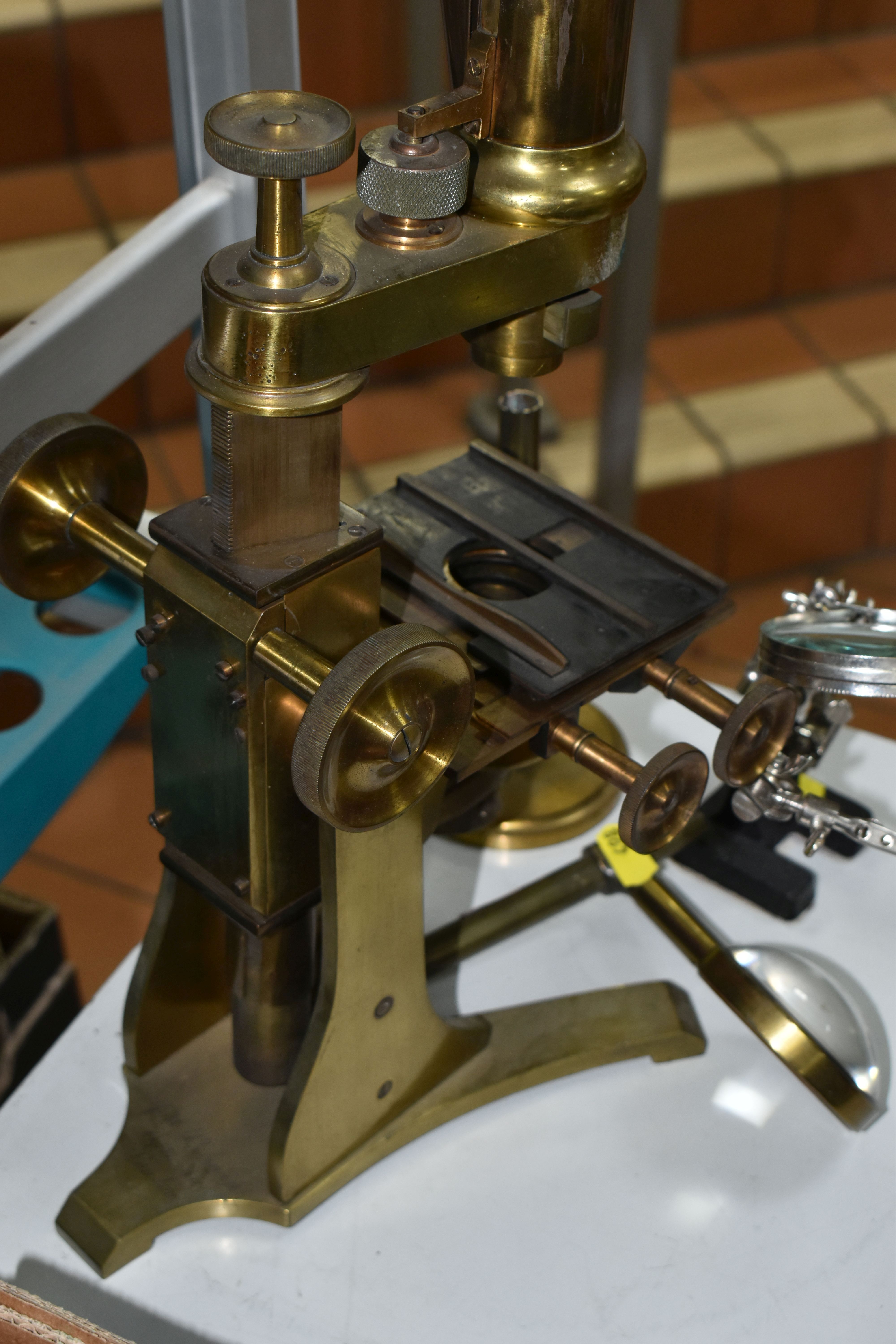 A LARGE BRASS VICTORIAN MICROSCOPE AND OTHER OPTICAL EQUIPMENT, a large double eyepiece microscope - Image 3 of 8