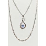 A TANZANITE AND DIAMOND PENDANT AND 9CT WHITE GOLD CHAIN, the pendant designed as a circular