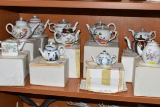 A COLLECTION OF TWELVE BOXED FRANKLIN MINT 'THE VICTORIA & ALBERT MUSEUM PORCELAIN TEAPOT