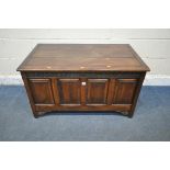 A 20TH CENTURY OAK BLANKET CHEST, with a hinged lid and foliate details, width 103cm x depth 60cm