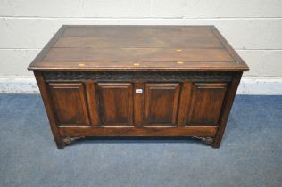 A 20TH CENTURY OAK BLANKET CHEST, with a hinged lid and foliate details, width 103cm x depth 60cm