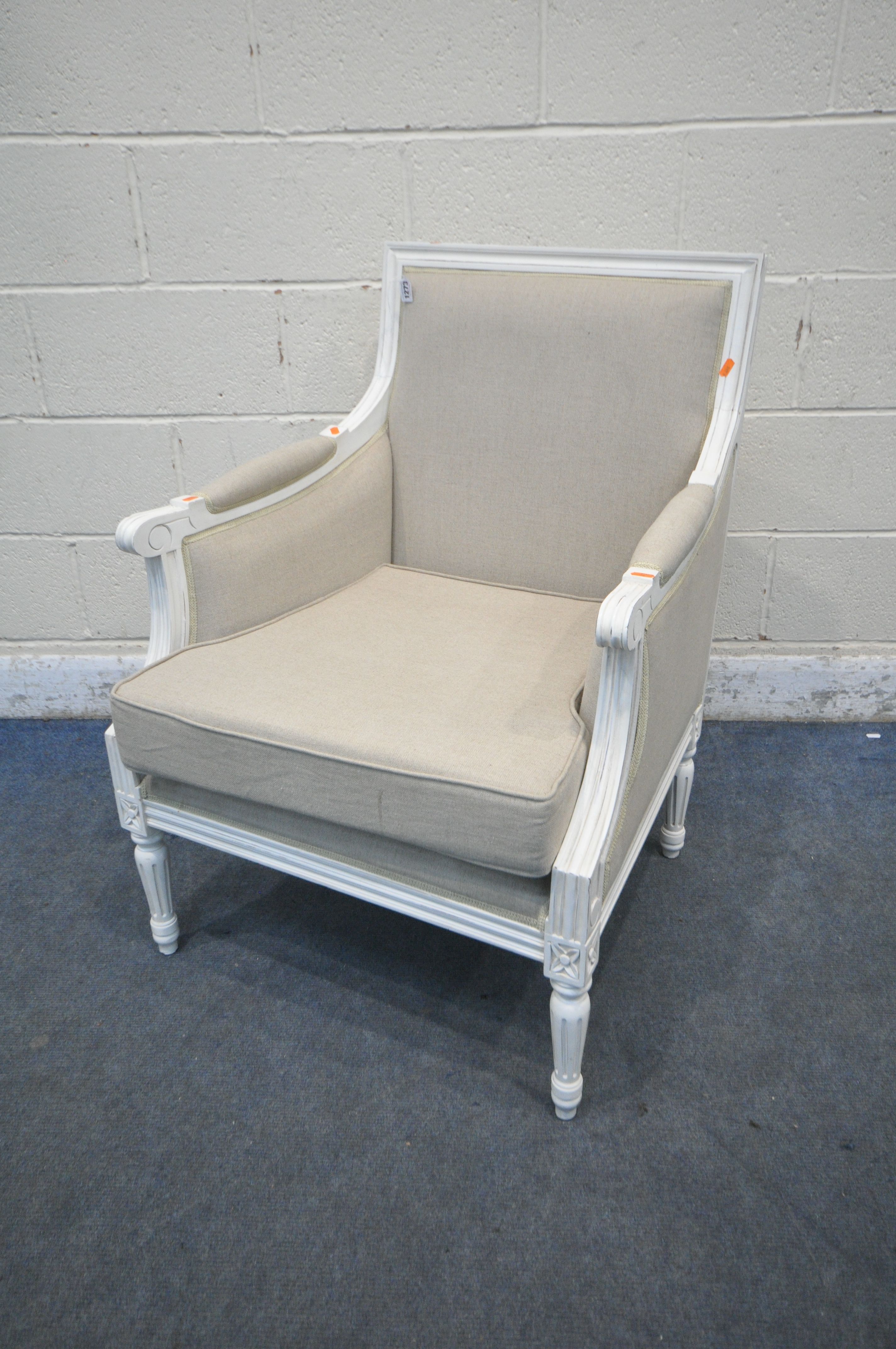 A REPRODUCTION FRENCH WHITE FRAMED AND BEIGE UPHOLSTERED ARMCHAIR (condition report: good)