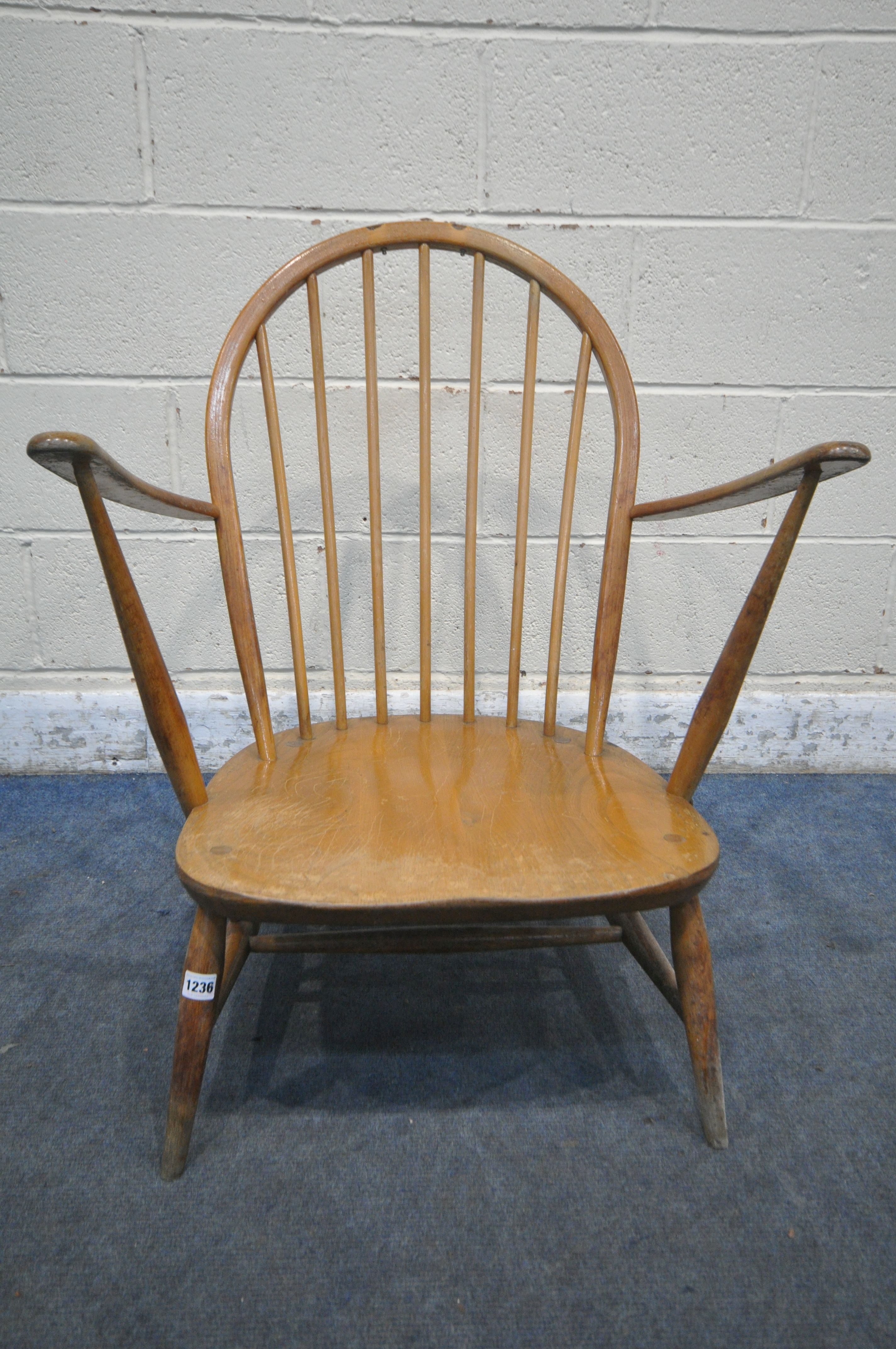 A MID CENTURY ERCOL WINDSOR ARMCHAIR, with a spindle hoop back (condition report: water stained - Image 2 of 5