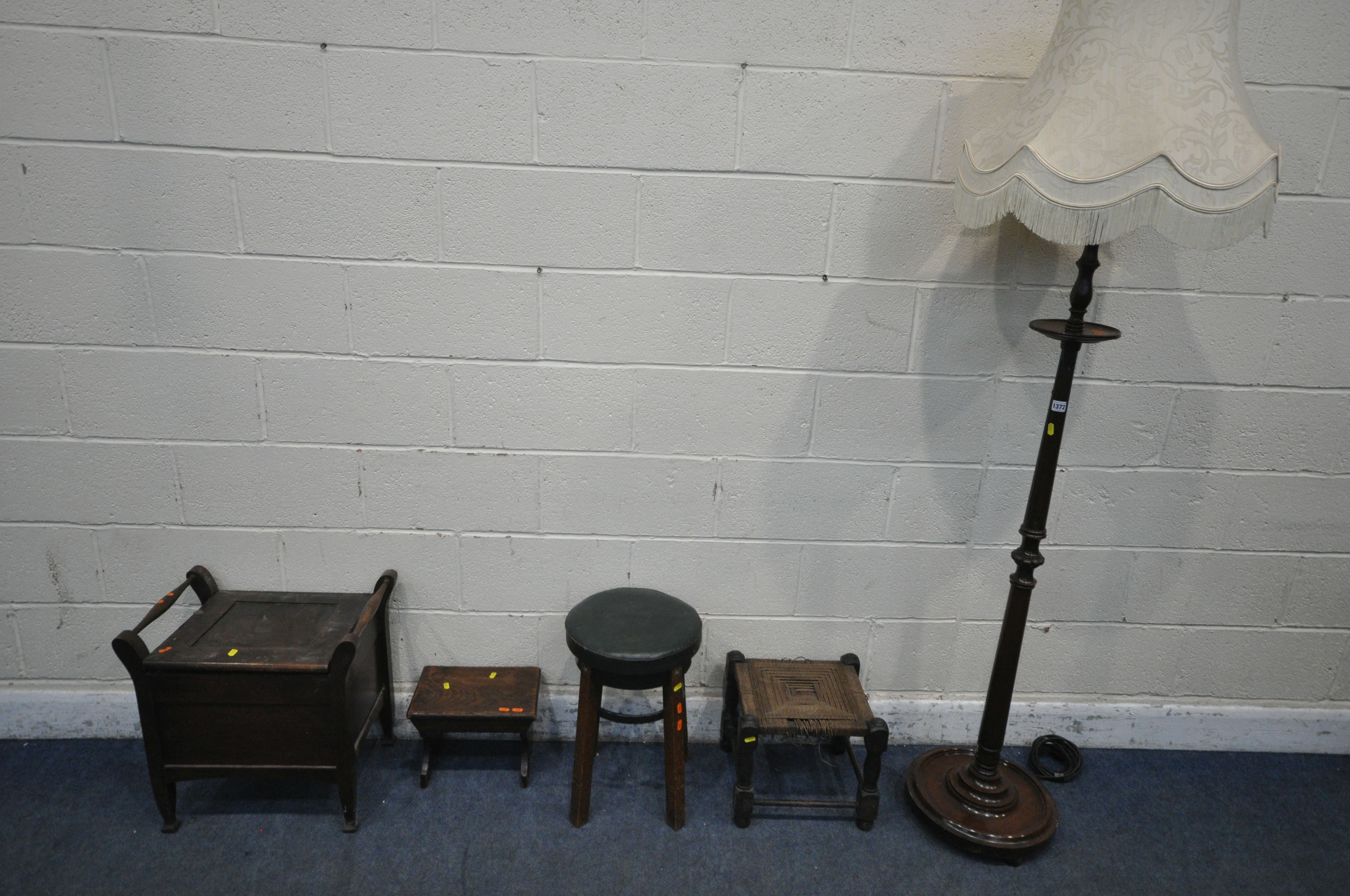 A 20TH CENTURY OAK STANDARD LAMP, with a small circular shelf, height to fitting 155cm, a mahogany