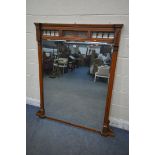 AN EDWARDIAN WALNUT OVERMANTEL MIRROR, with turned spindles and open fretwork, 110cm x 114cm (