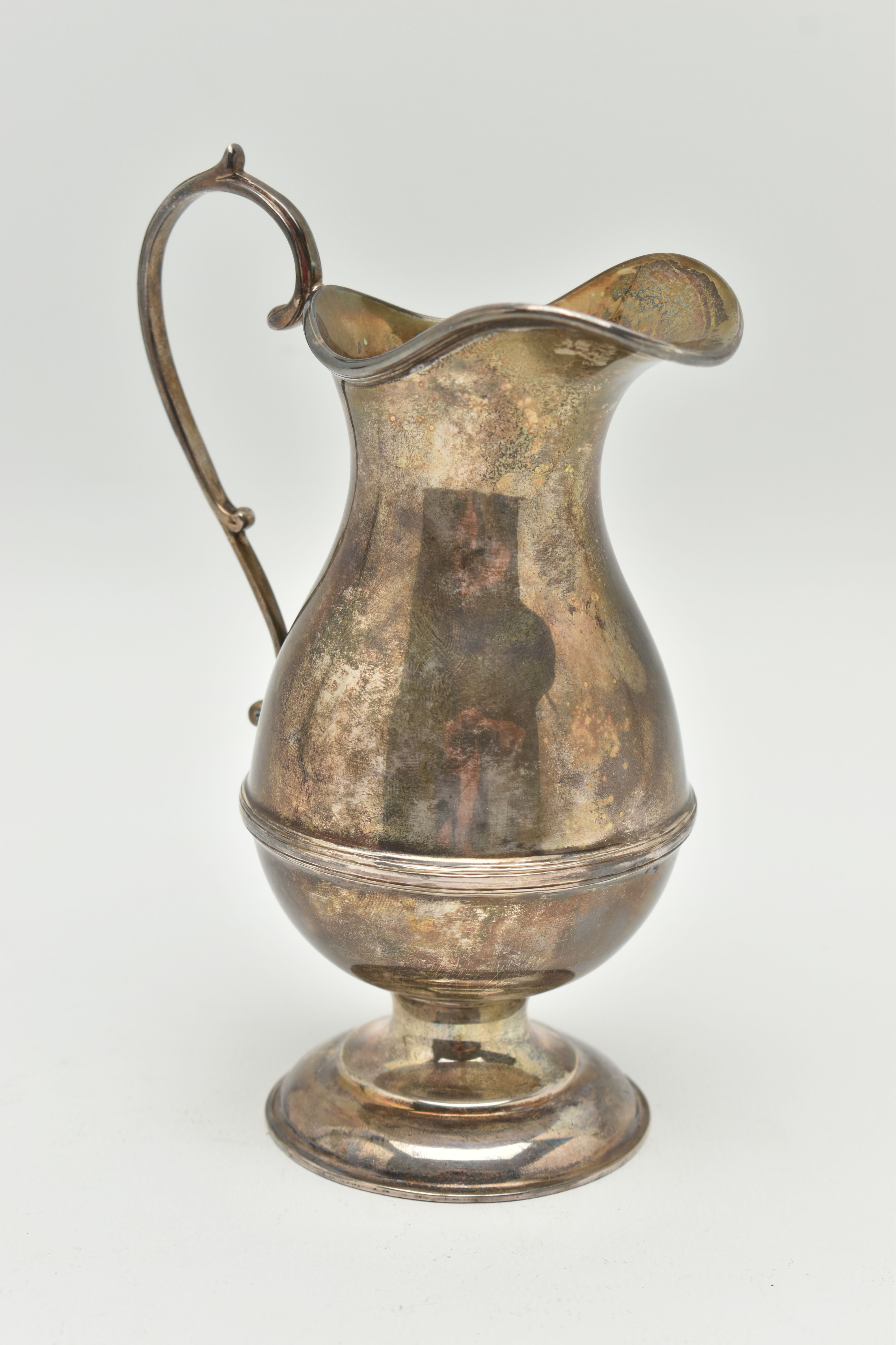 A GEORGE V SILVER CREAM JUG, a baluster form jug with a scrolling handle, approximate height - Image 2 of 5