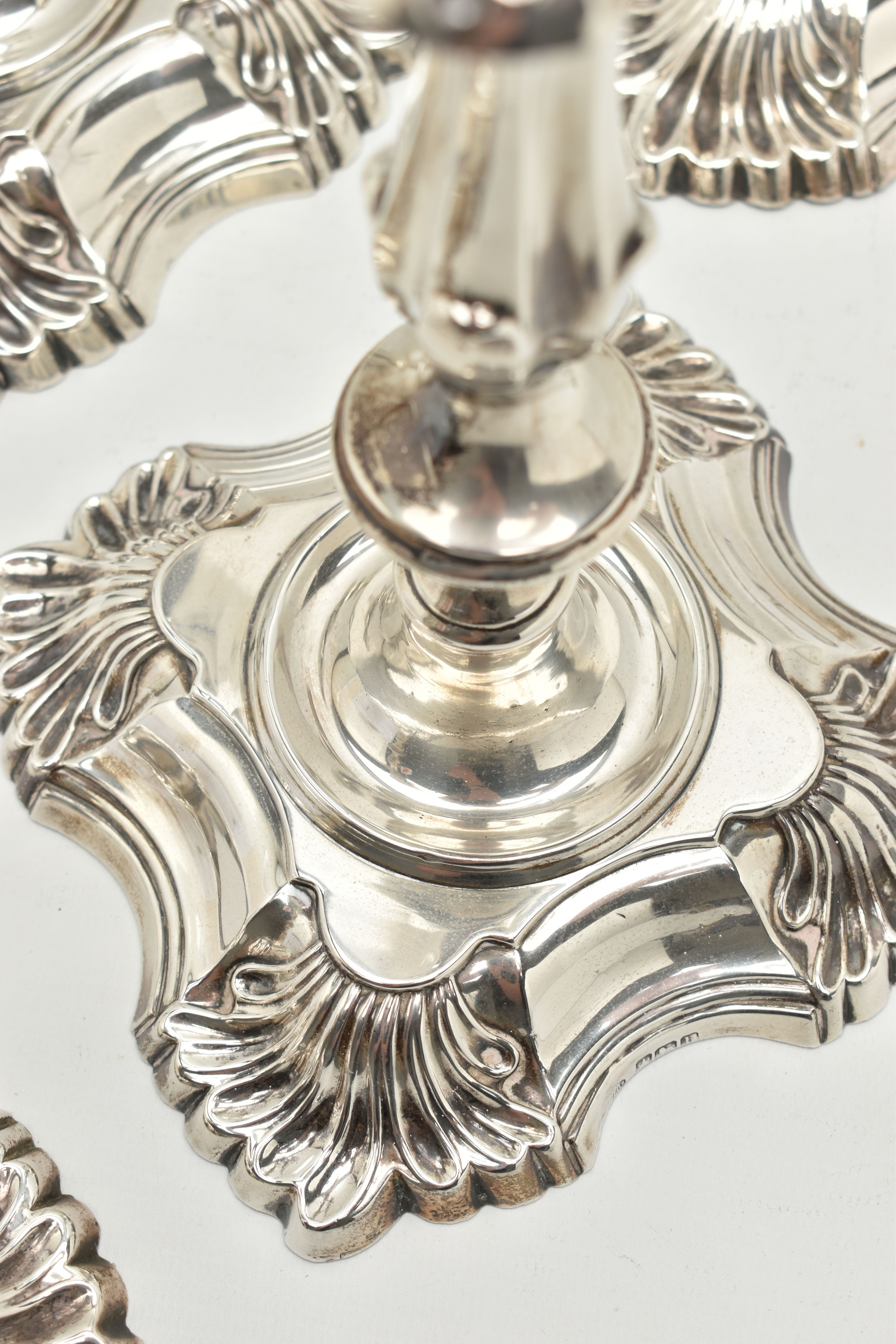 A GEORGE V SILVER SET OF FOUR CANDLESTICKS IN GEORGE II STYLE, with removable shaped square drip - Image 9 of 10
