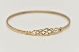 A 9CT GOLD BANGLE, a Celtic design light weight bangle, fitted with a hook fastening, hallmarked 9ct