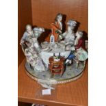 A 19TH CENTURY PARIS PORCELAIN FIGURE GROUP OF FIVE 18TH CENTURY FIGURES AROUND A DINING TABLE, with