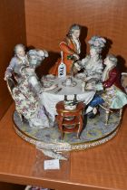 A 19TH CENTURY PARIS PORCELAIN FIGURE GROUP OF FIVE 18TH CENTURY FIGURES AROUND A DINING TABLE, with