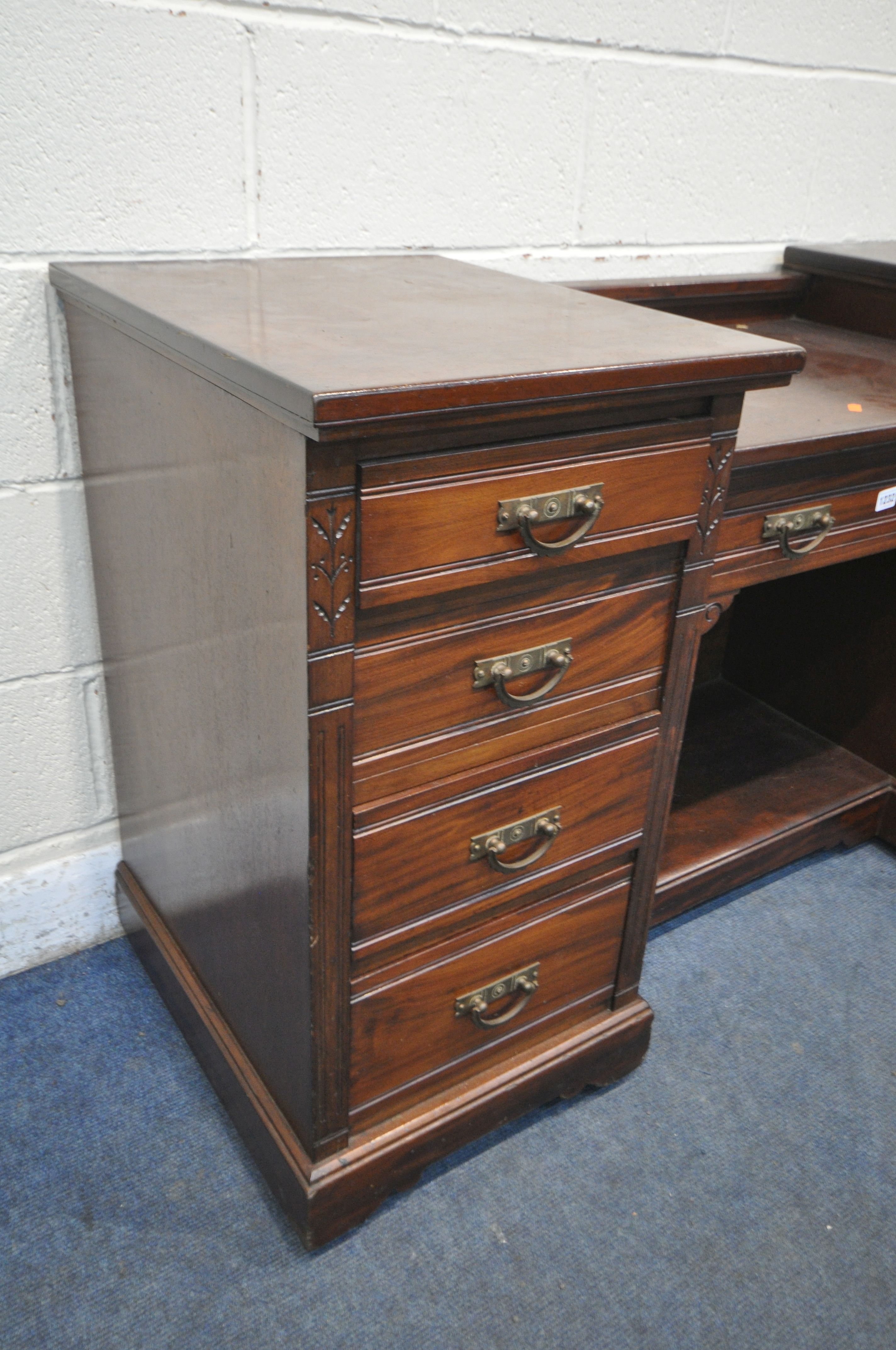 AN EDWARDIAN MAHOGANY DESK, fitted with nine drawers, on casters, width 152cm x depth 56cm x - Image 3 of 3