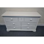 A MODERN WHITE SIDEBOARD, fitted with seven assorted drawers, length 134cm x depth 44cm x height