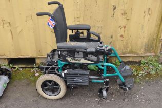 A POWER TEC F40 ELECTRIC WHEELCHAIR (spares or repairs) with two footrests (condition report: