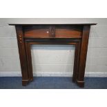 A MAHOGANY FIRE SURROUND, width 153cm x height 139cm (condition report: pieces cut out to fit in a