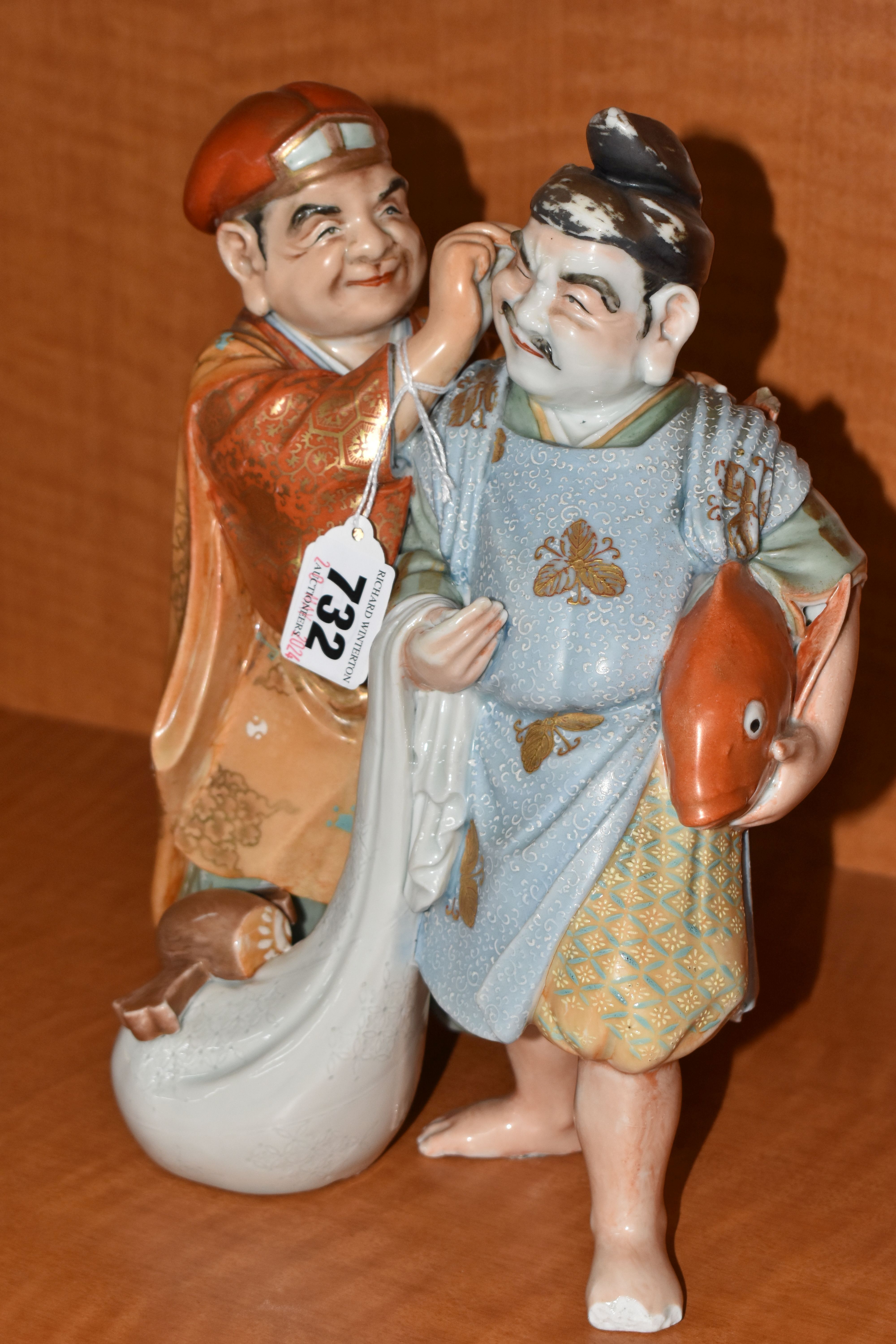 A LATE 19TH / EARLY 20TH CENTURY JAPANESE PORCELAIN FIGURE GROUP OF TWO MEN, one holding a carp - Image 2 of 9
