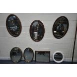 FIVE VARIOUS OVAL MIRRORS, to include two gilt framed mirrors, and three mahogany mirrors, along