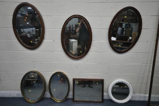 FIVE VARIOUS OVAL MIRRORS, to include two gilt framed mirrors, and three mahogany mirrors, along