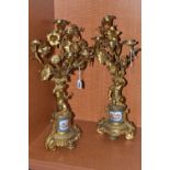 A PAIR OF MID 19TH GILT METAL candelabra, the upper section of floral form fitted with candle