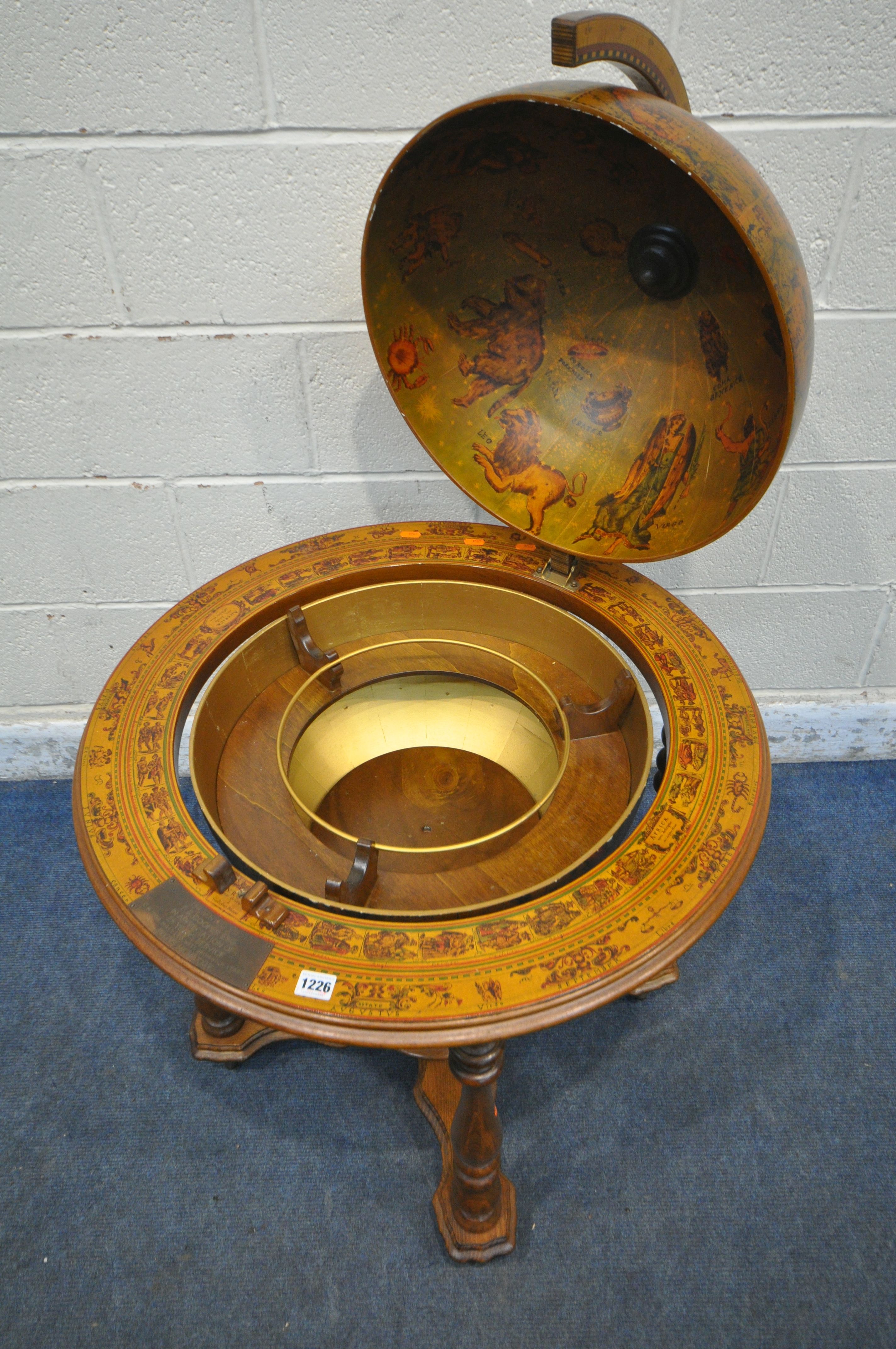 A 20TH CENTURY DRINKS GLOBE, the hinged top enclosing a fitted interior, on turned legs united by - Image 3 of 5