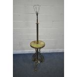 A FRENCH BRASS AND ONYX STANDARD LAMP, with a circular shelf, standing on triple foliate legs with